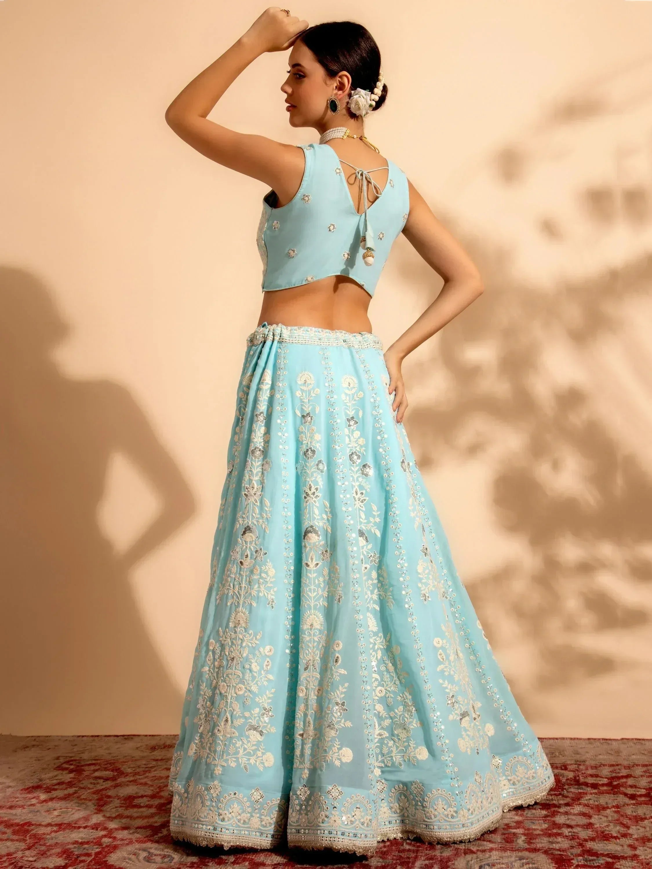 Light blue embroidered lehenga choli with floral detailing, perfect for Indian ethnic wear occasions