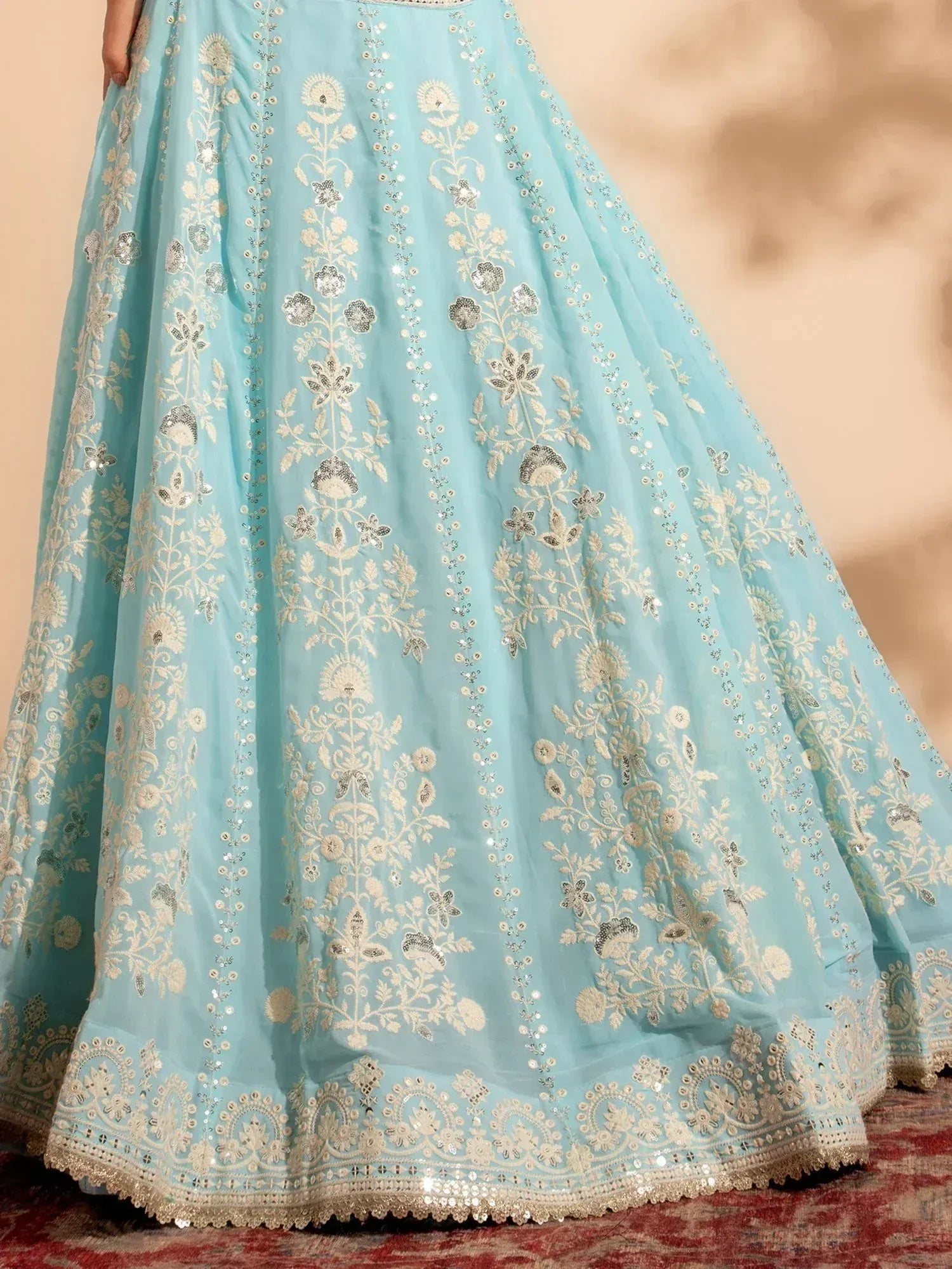 Light blue lehenga with gold floral embroidery and sequin detailing, ideal for Indian ethnic wear