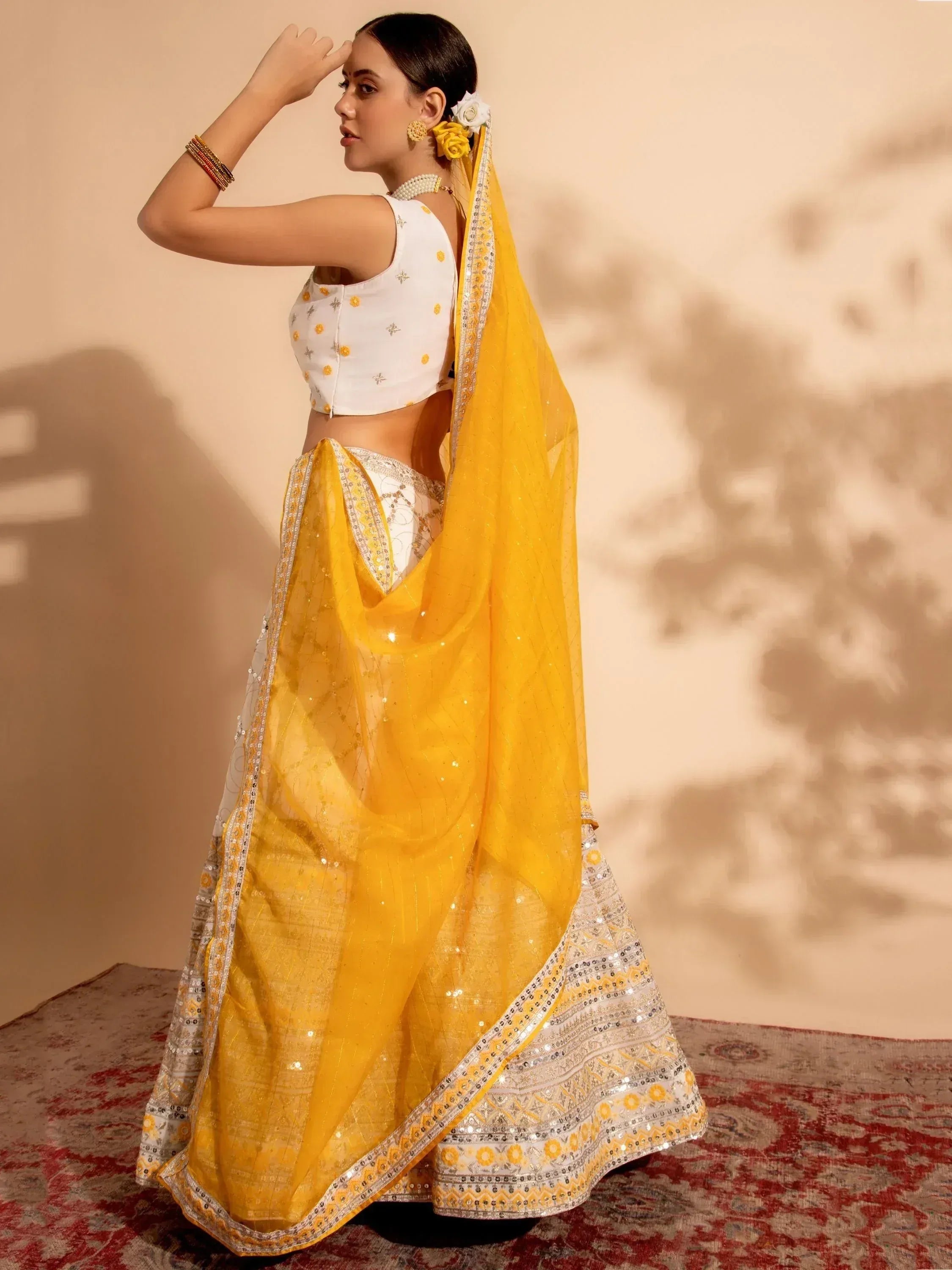 Yellow and white designer lehenga choli with sequin embroidery, perfect for Indian ethnic occasions