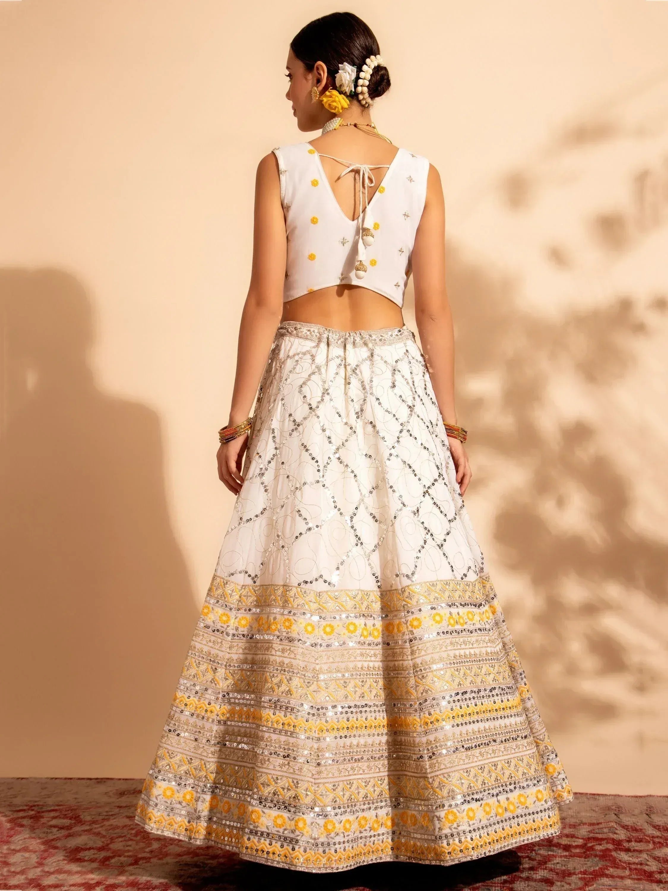 White and yellow embroidered lehenga choli with sequin detailing, perfect for Indian ethnic wear occasions