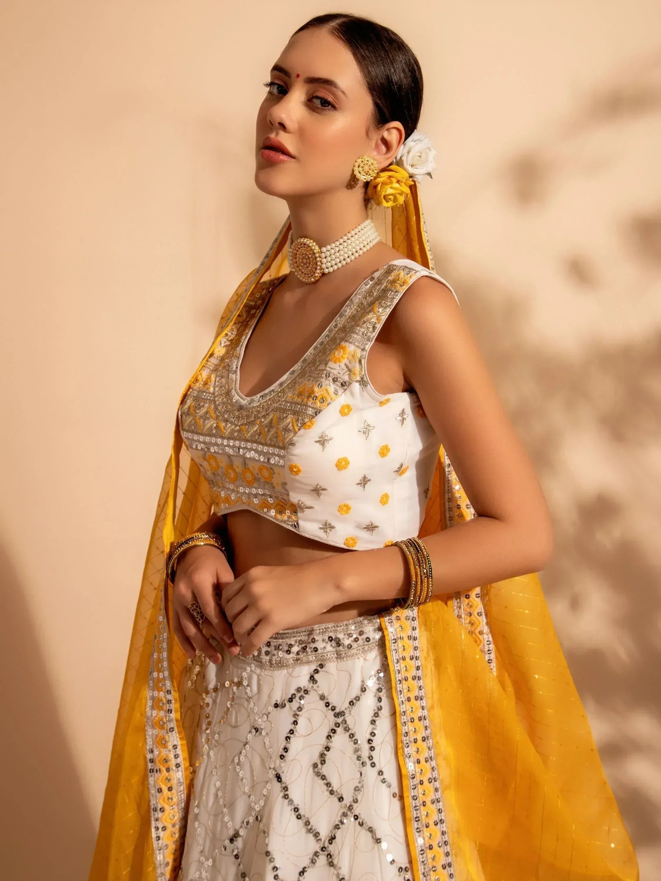 White and yellow embroidered lehenga choli with sequin work, perfect for Indian ethnic wear occasions