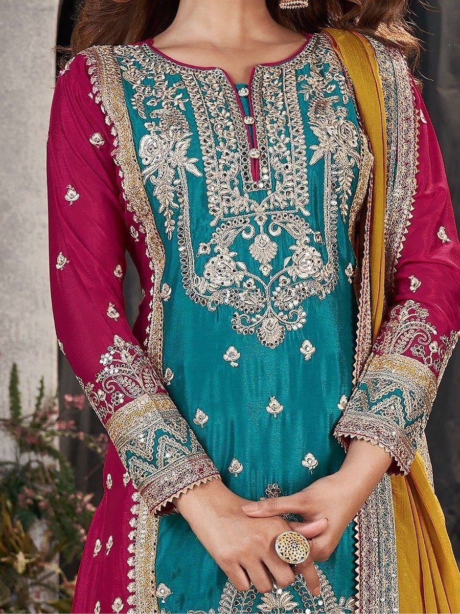 Teal and magenta embroidered salwar kameez with gold detailing and yellow dupatta, perfect for festive occasions.