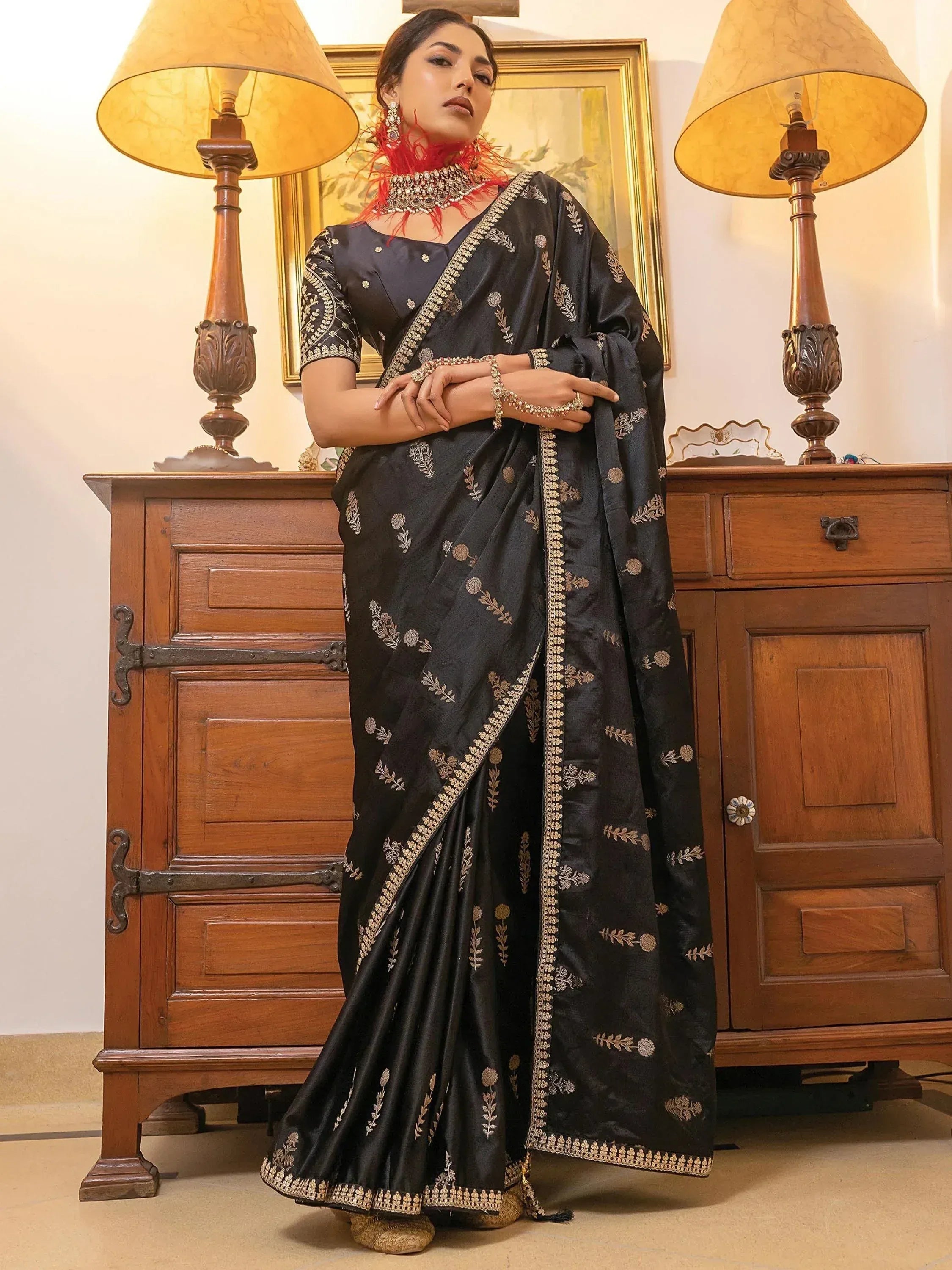 Black embroidered saree with gold floral motifs, perfect for Indian ethnic wear and festive occasions.