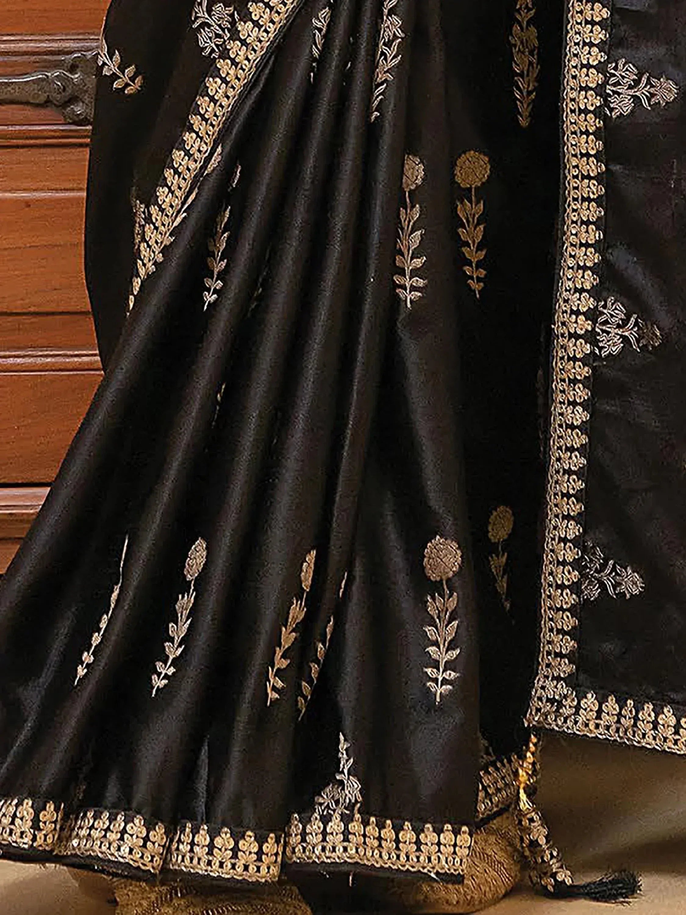 Black designer lehenga with gold floral embroidery and border detail