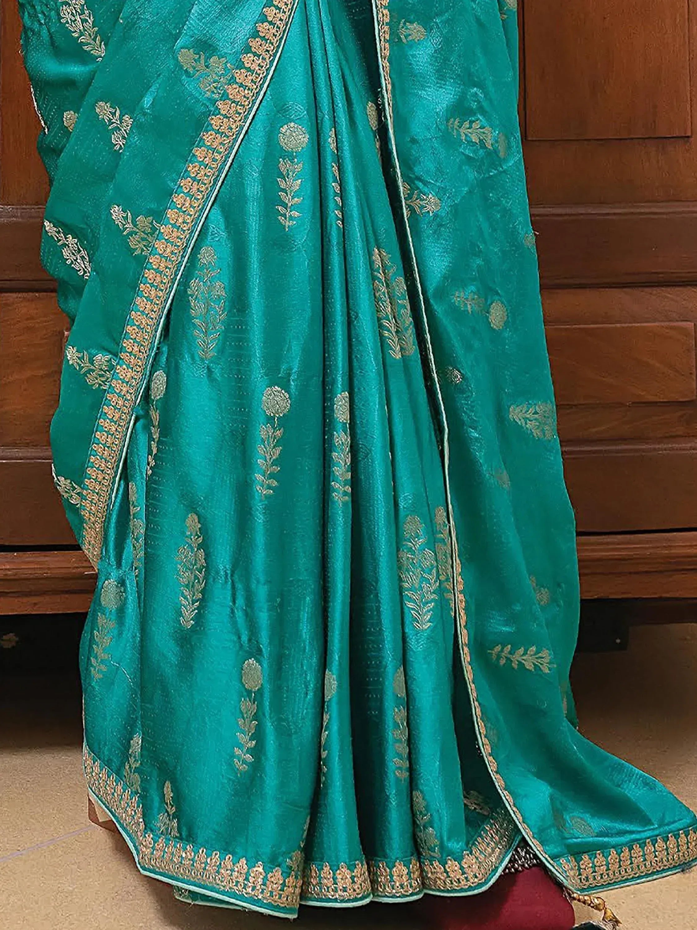 Teal green designer saree with gold floral embroidery and border, ethnic wear for women