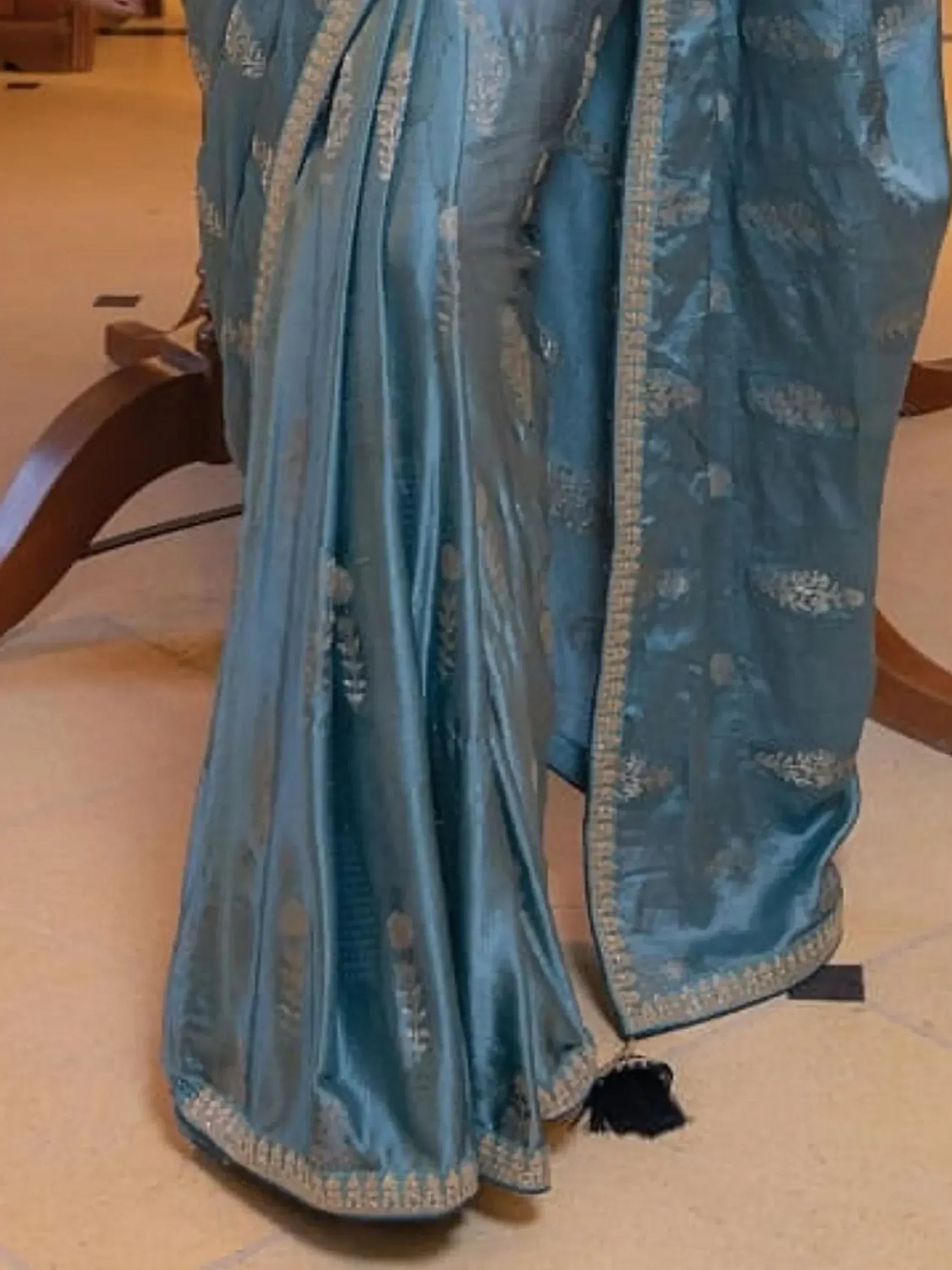 Blue designer lehenga choli with gold embroidery and tassel detail, ethnic Indian wear