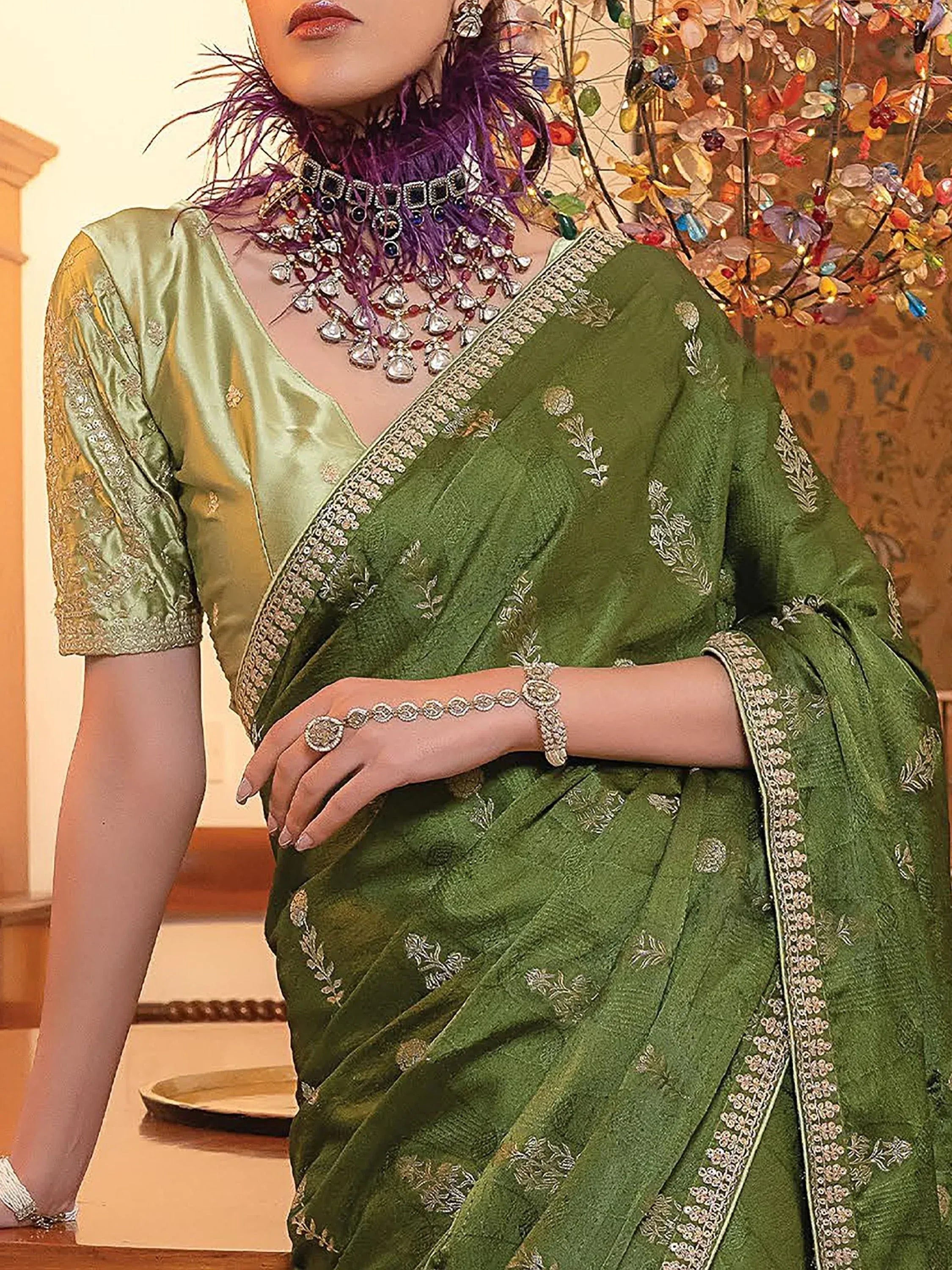 Elegant green embroidered saree with matching blouse, perfect for Indian ethnic wear occasions.