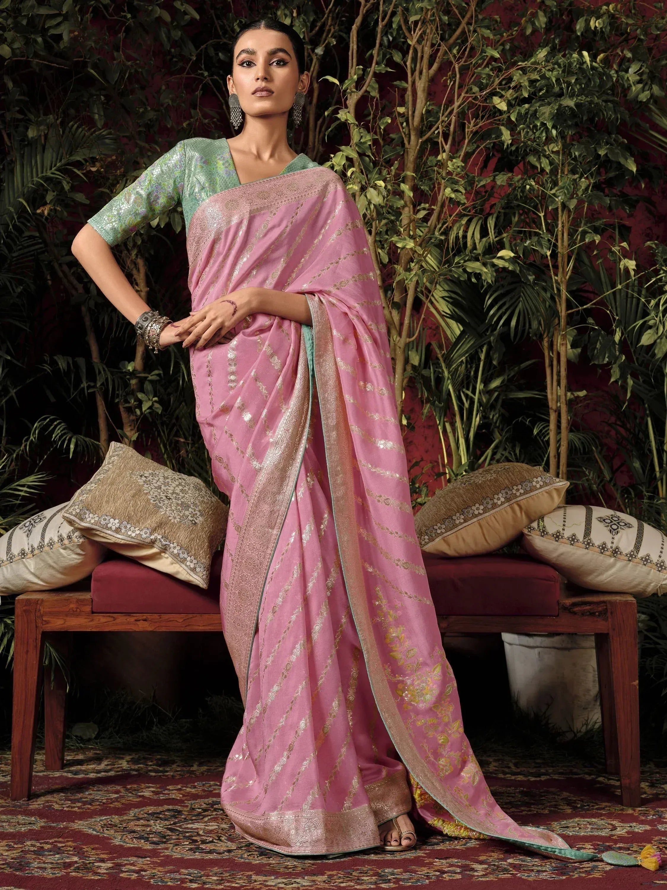 Pink designer saree with gold embroidery and green blouse, perfect for ethnic occasions