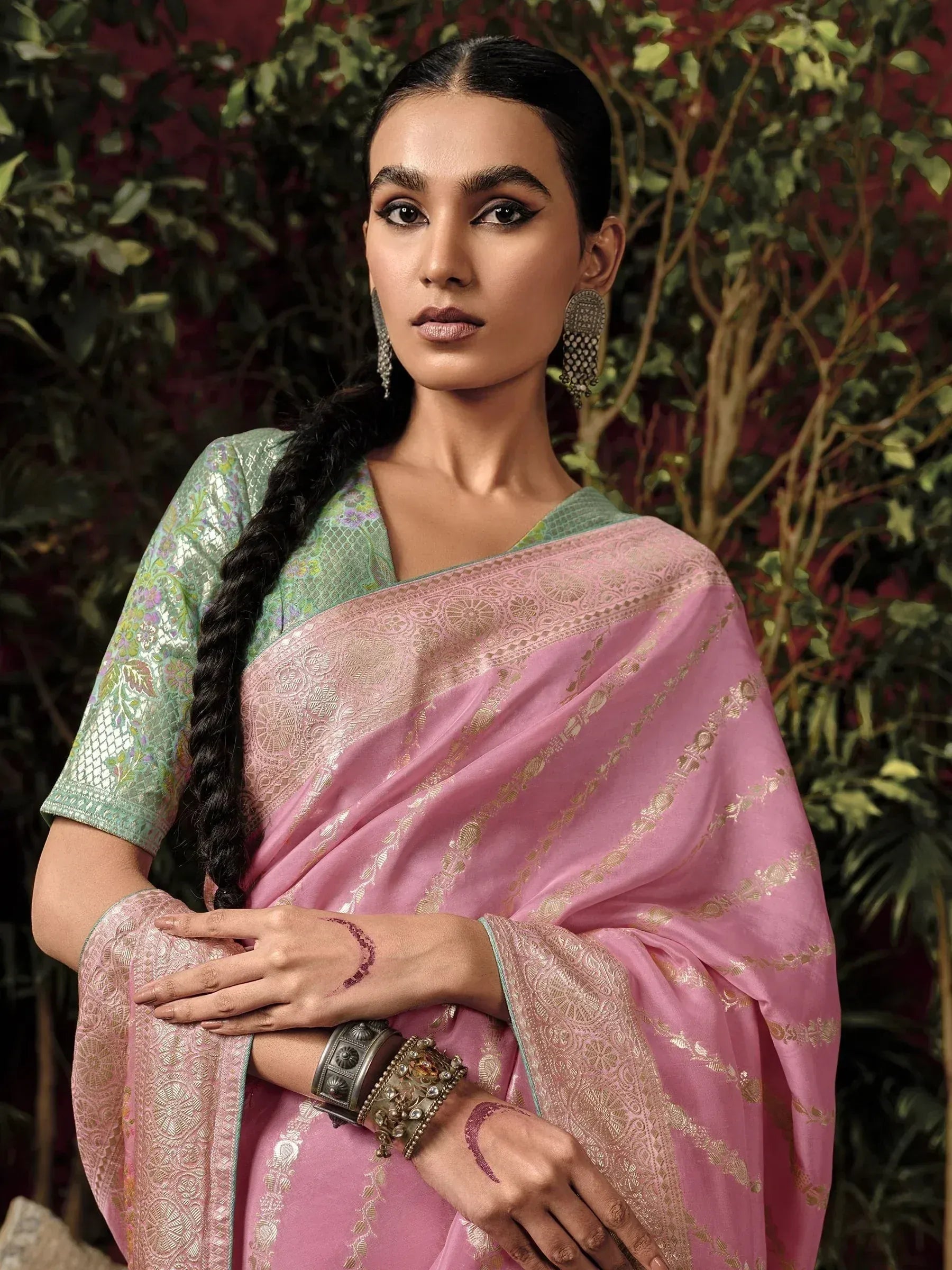 Elegant pink saree with gold embroidery, paired with green blouse, perfect for Indian ethnic occasions.