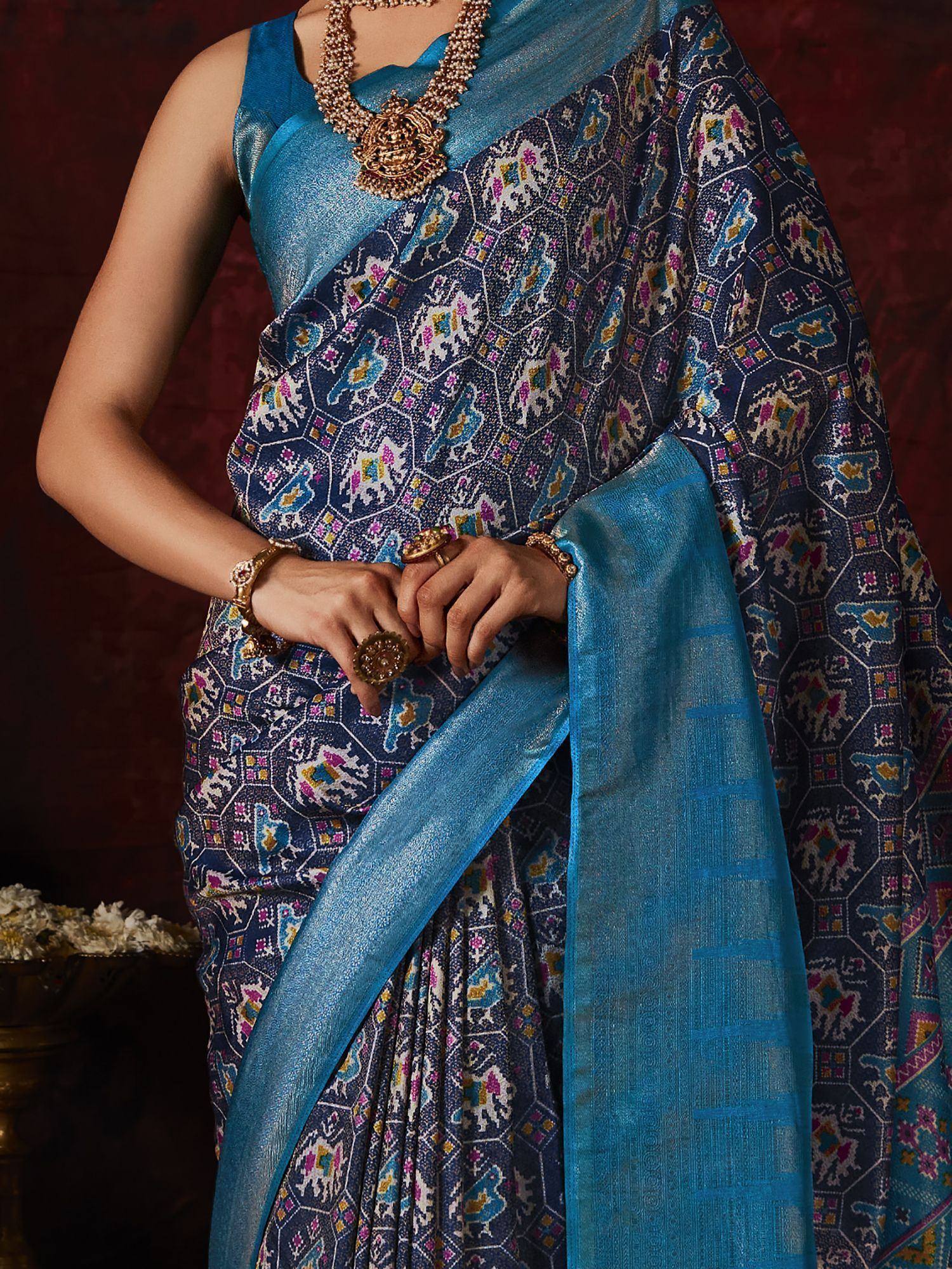 Blue printed saree with gold jewelry, ethnic Indian wear for festive occasions