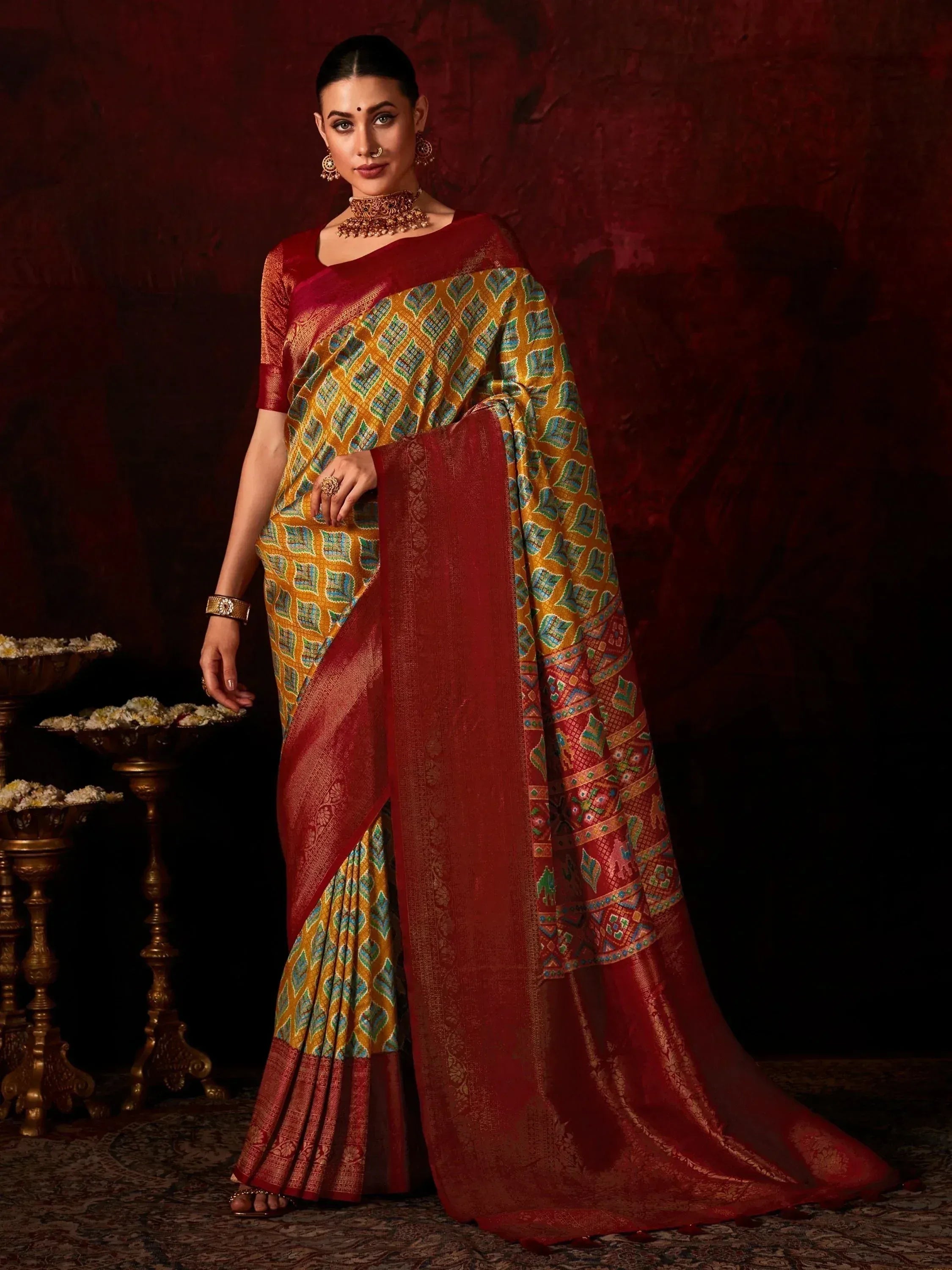 Elegant Indian saree in maroon and gold with intricate geometric patterns, perfect for festive occasions.