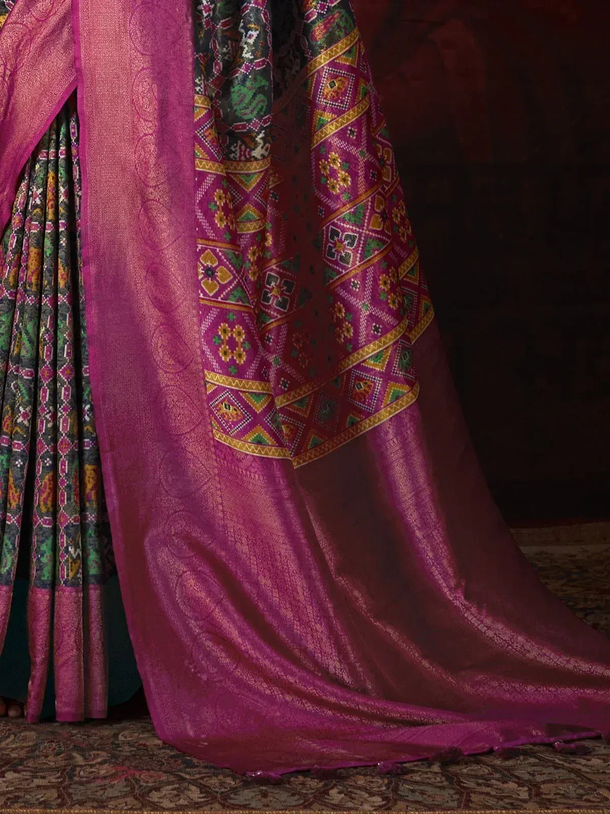 Vibrant purple ethnic saree with intricate geometric and floral embroidery, perfect for festive occasions.