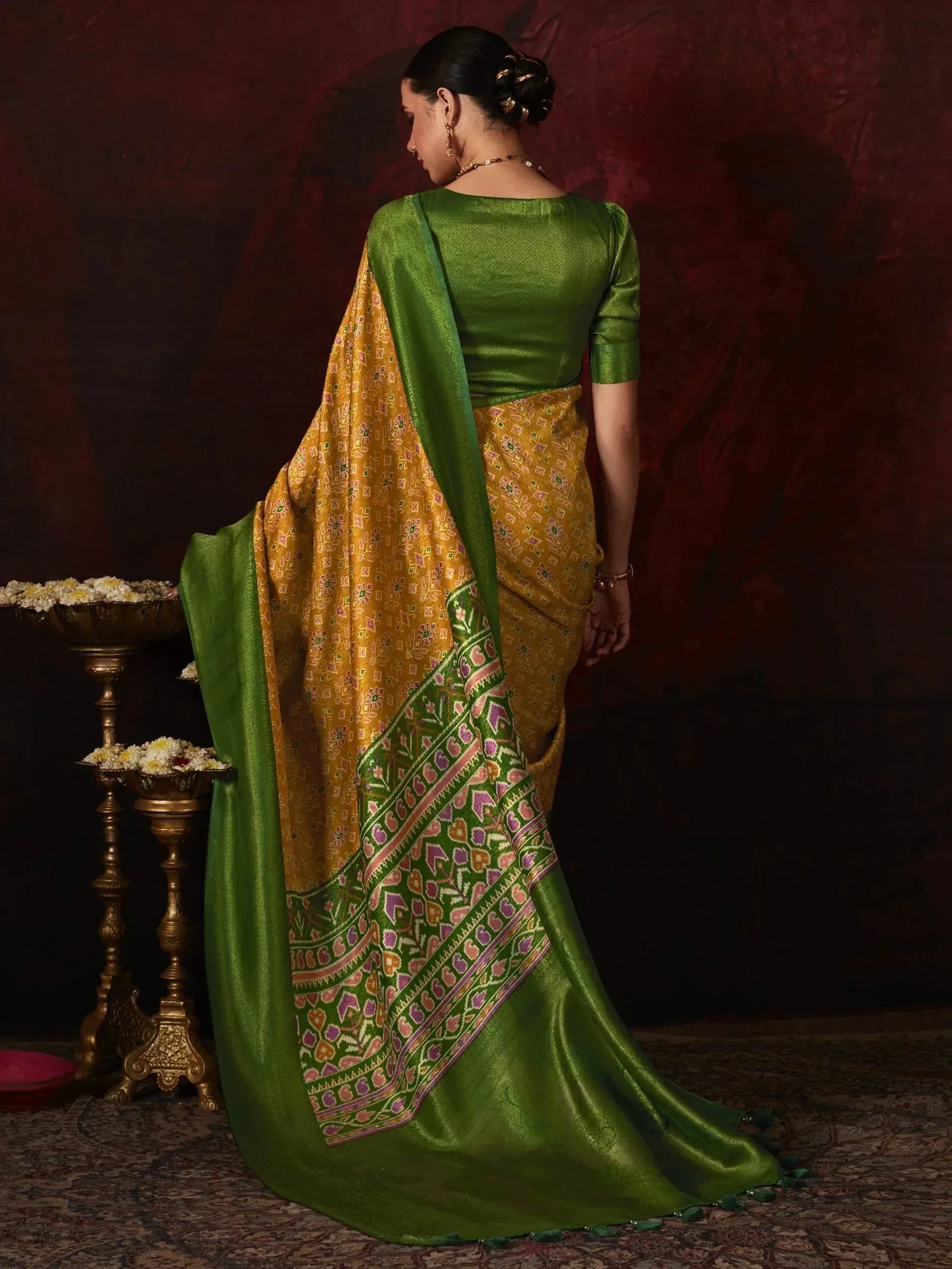Green and gold printed saree with floral border, paired with matching blouse, ethnic Indian wear