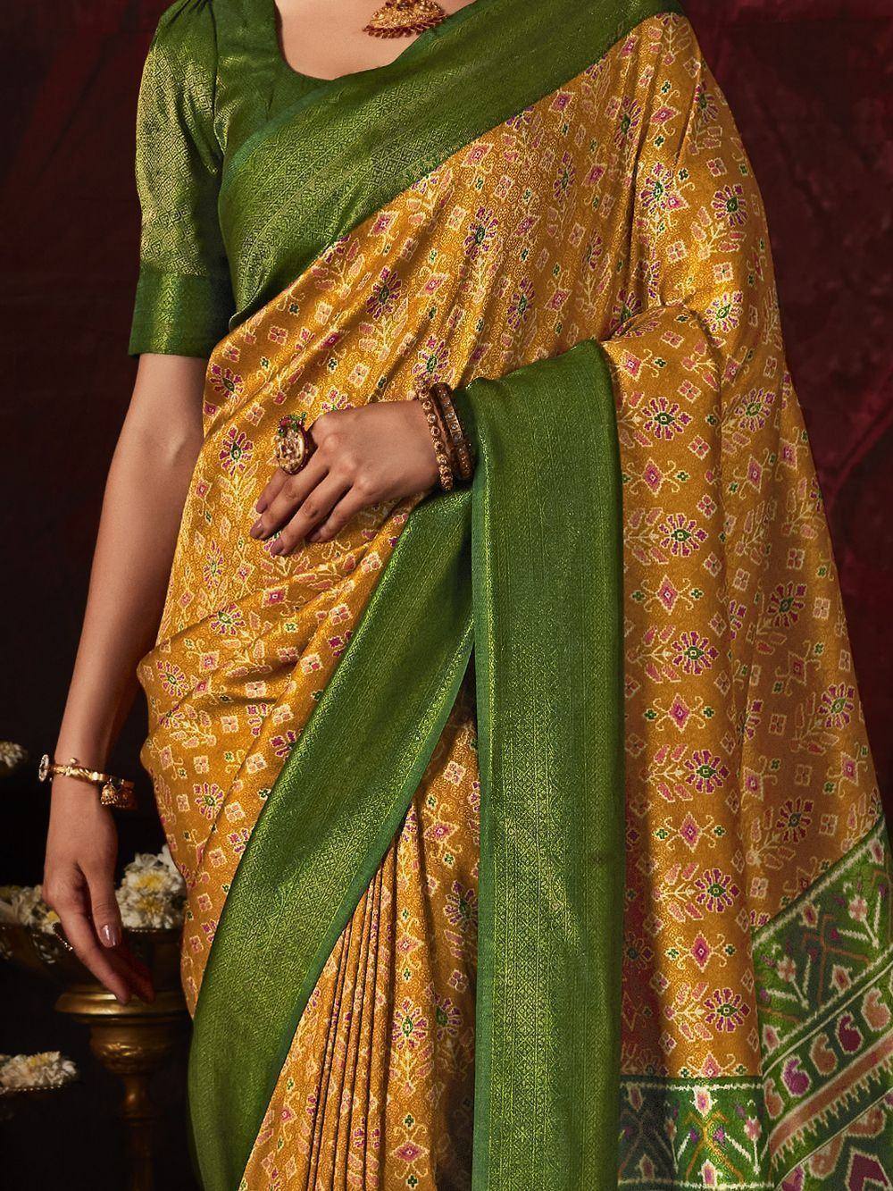 Yellow floral saree with green blouse and border, ethnic Indian wear