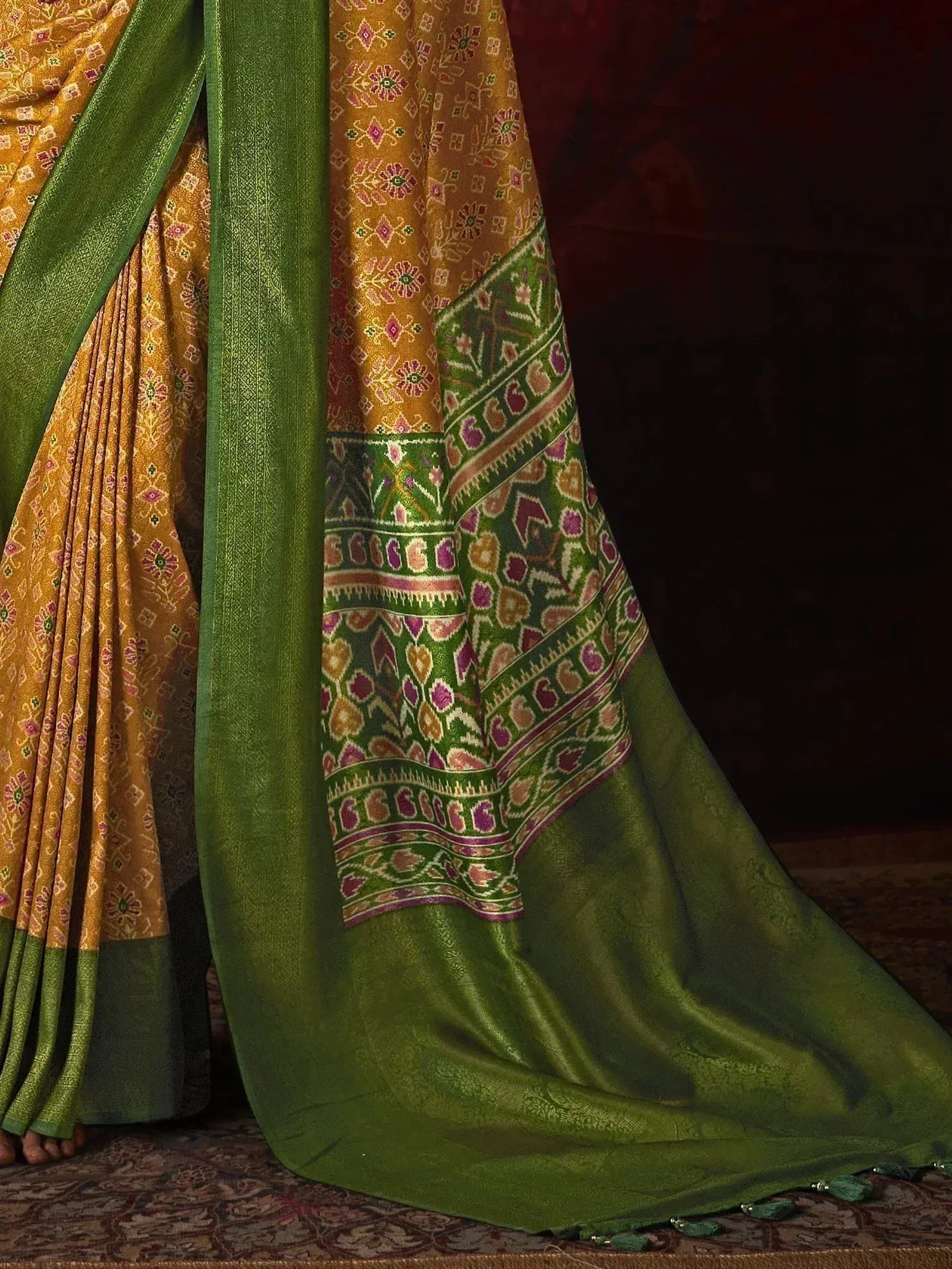 Mustard and green ethnic saree with floral ikat print and woven border, perfect for Indian occasions