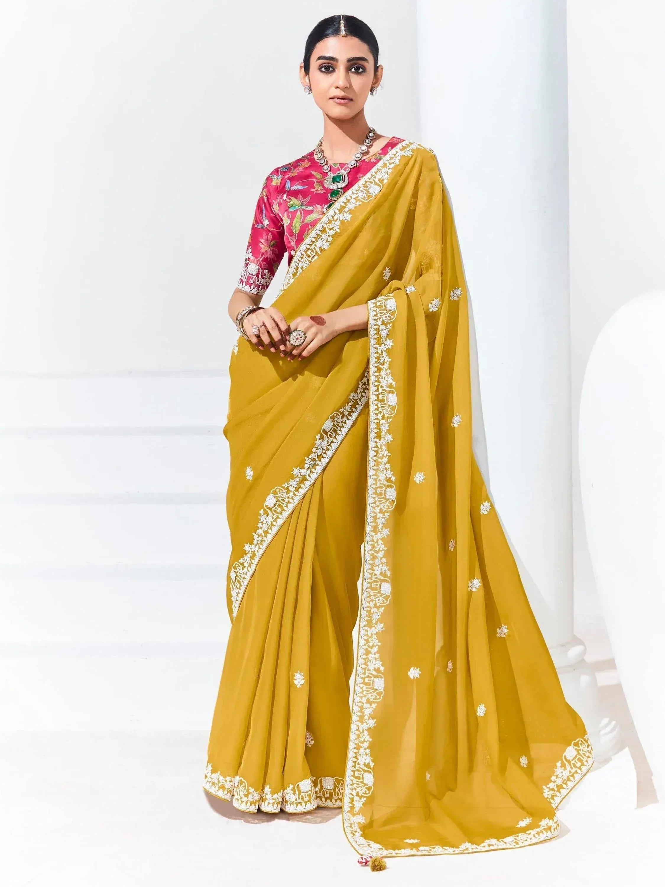 Mustard yellow saree with white embroidery and pink floral blouse, Indian ethnic wear