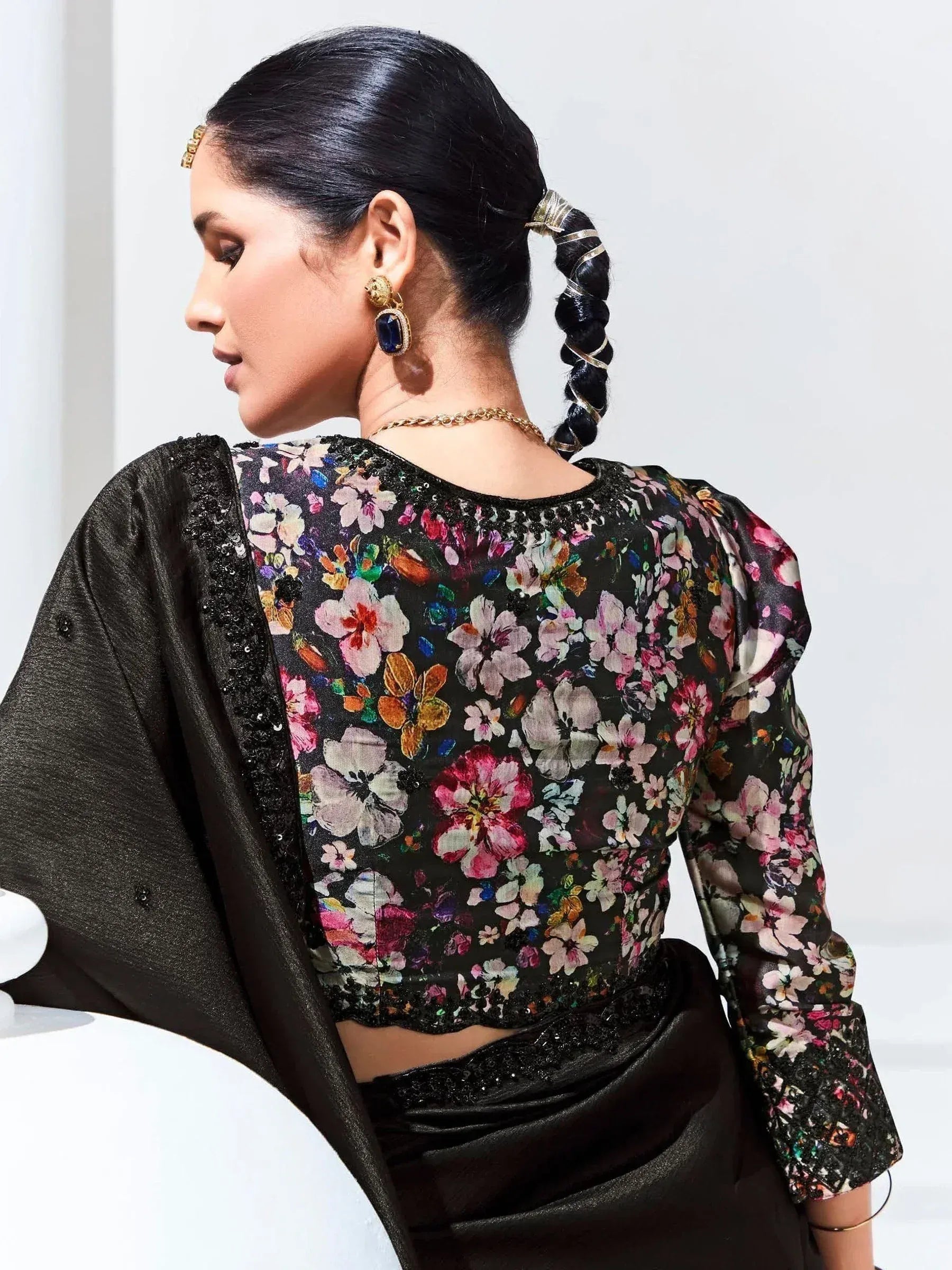 Floral print ethnic blouse with black sequin trim, paired with matching skirt and gold jewelry