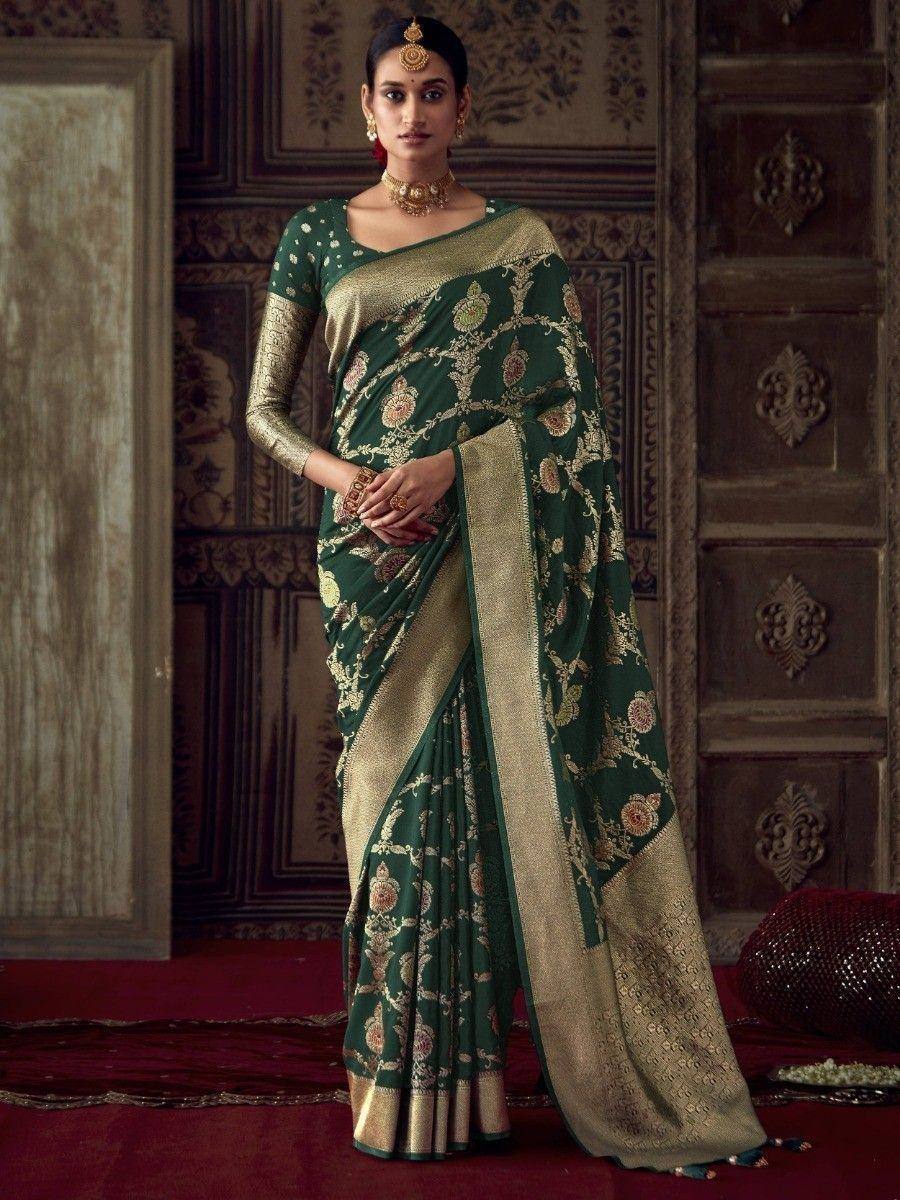 Emerald green designer saree with gold floral embroidery and border, paired with matching blouse for ethnic wear