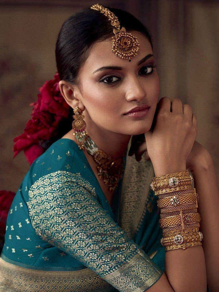 Glamorous Teal Blue Zari Woven Georgette Festival Wear Saree