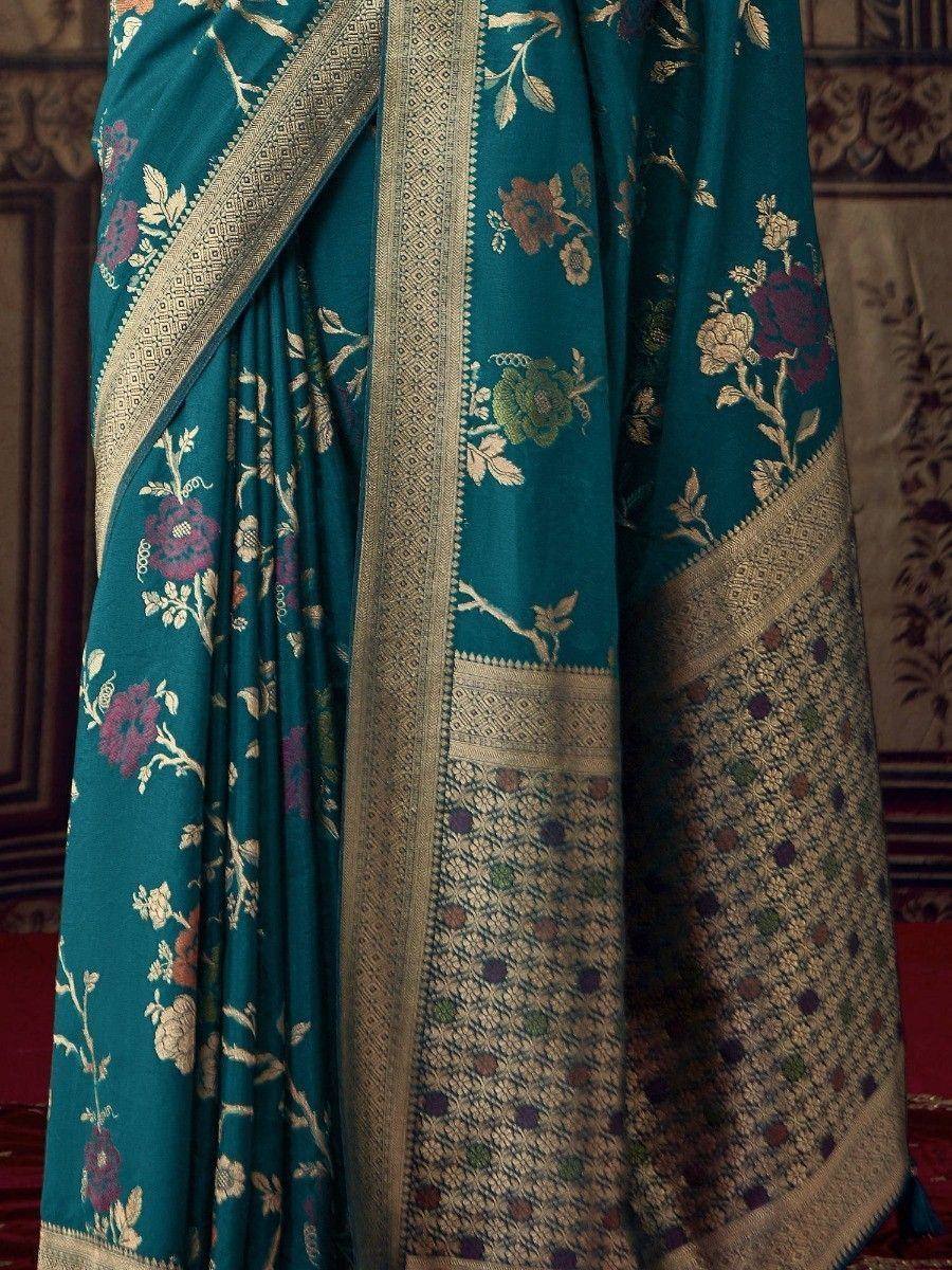 Teal floral saree with gold zari border, ethnic Indian wear for festive occasions