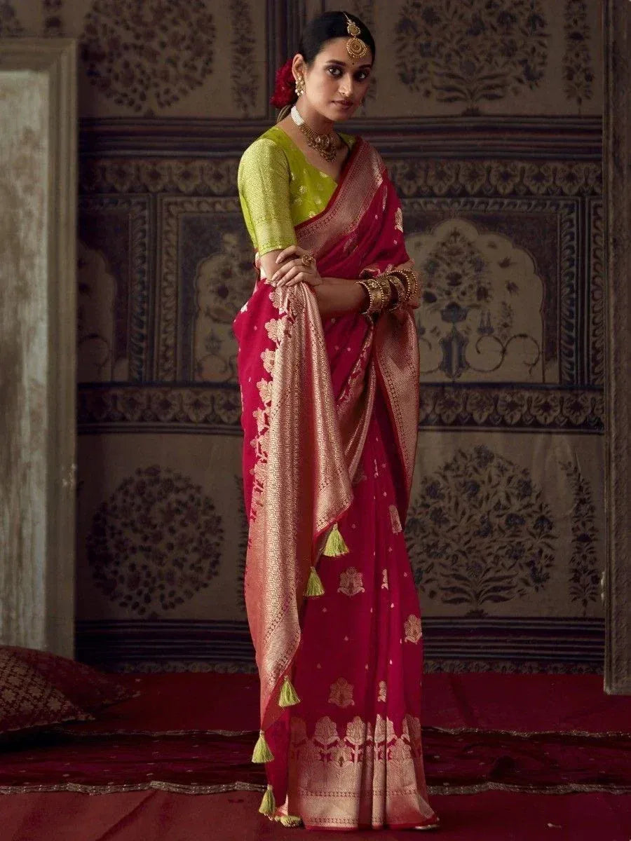 Woman in red and gold embroidered saree with green blouse, traditional Indian ethnic wear
