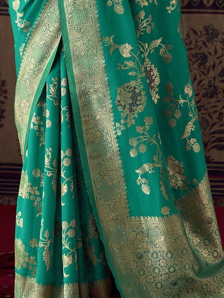 Emerald green saree with gold floral zari work and intricate border, perfect for Indian ethnic occasions