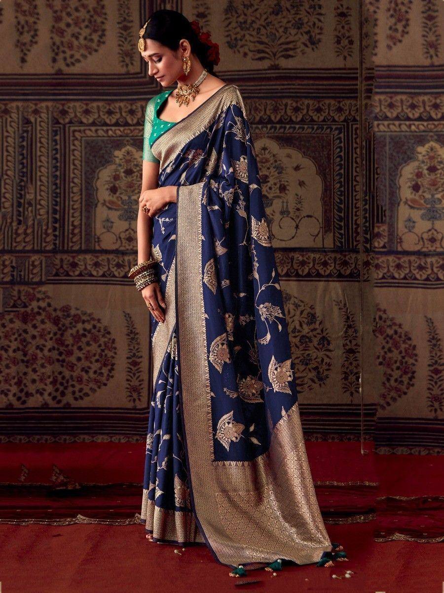 Navy blue floral print saree with gold border, paired with green blouse, ethnic Indian wear