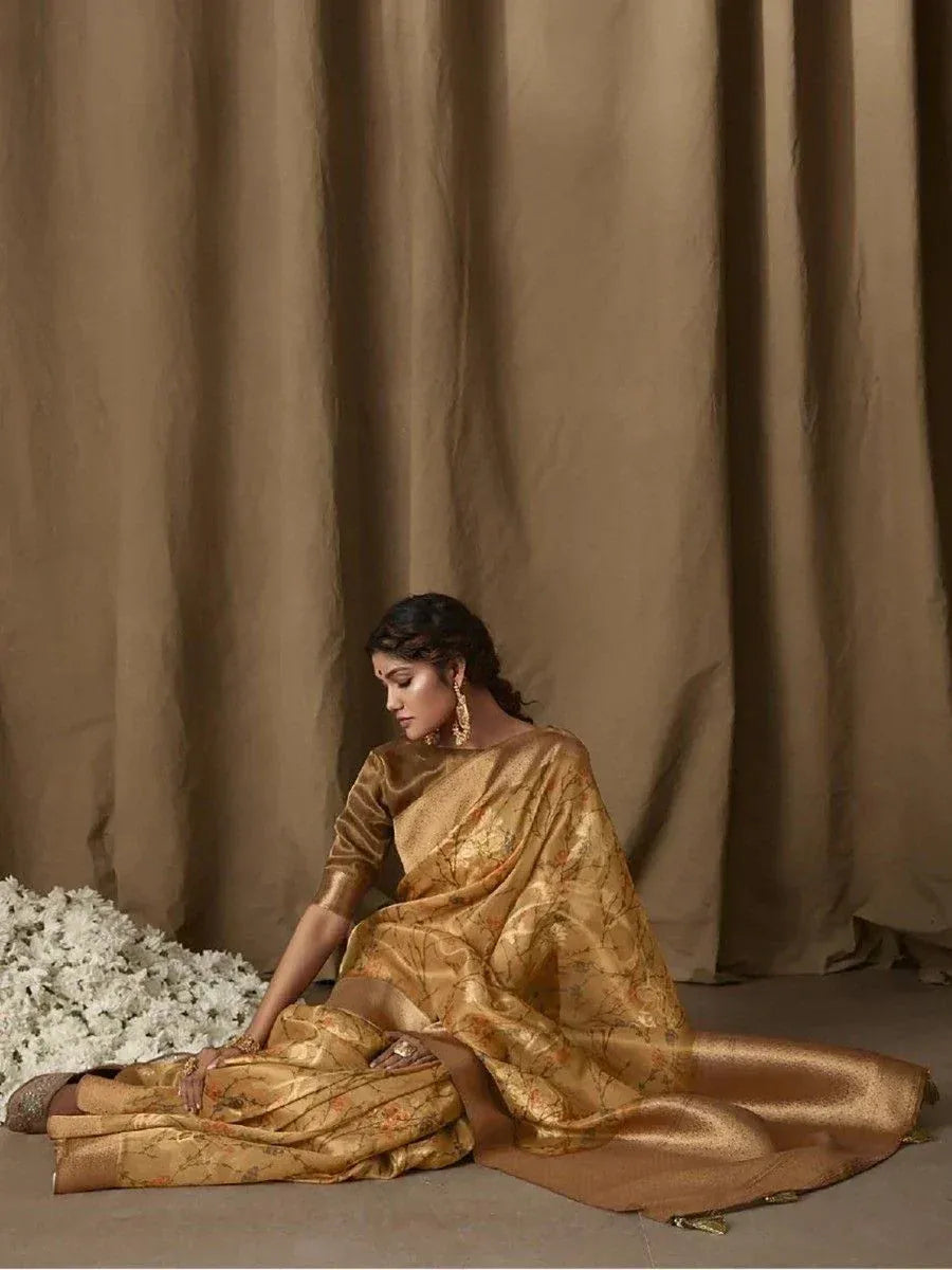 Elegant golden saree with floral motifs, styled with traditional jewelry for Indian ethnic wear