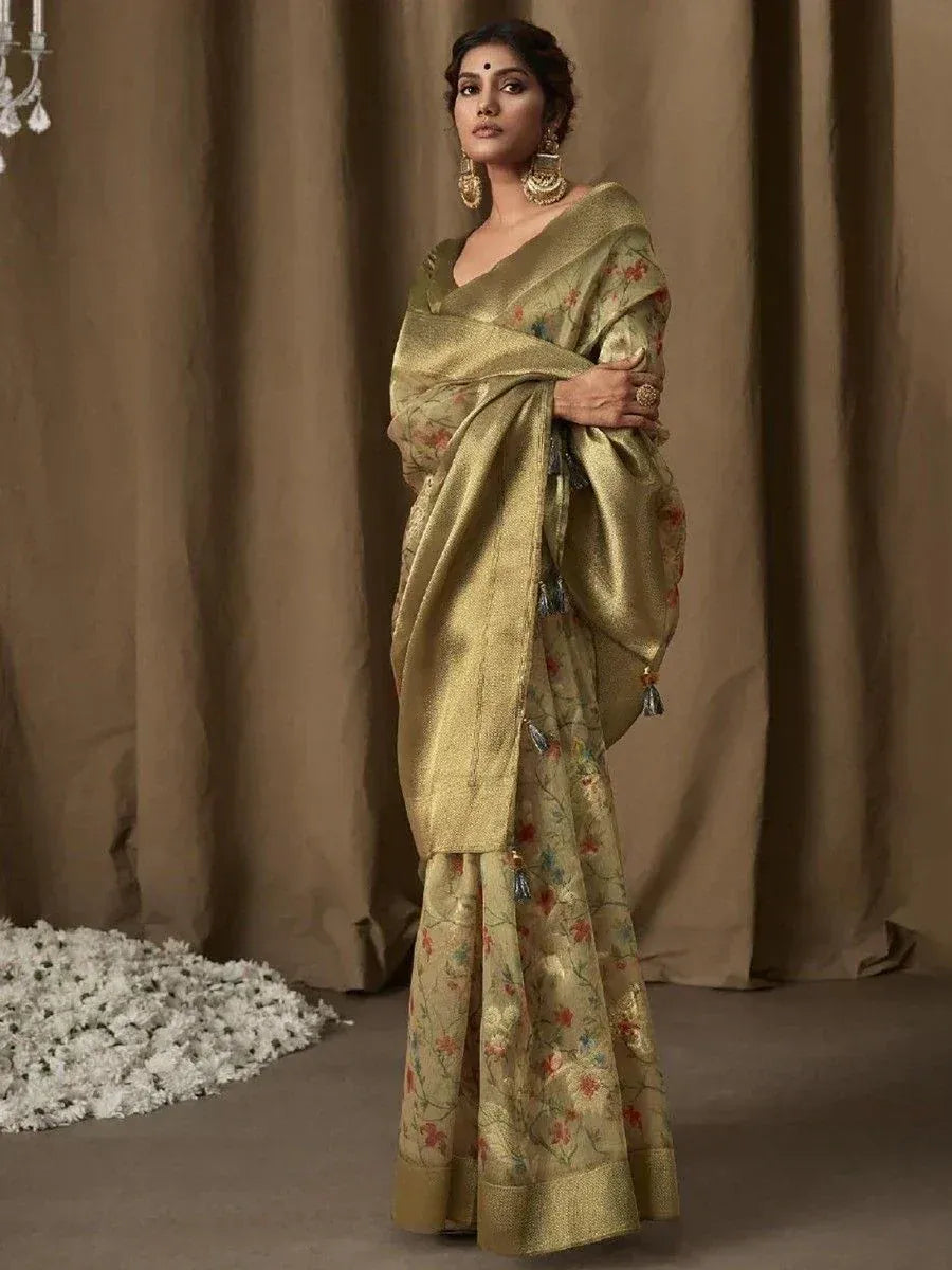Elegant gold floral saree with tassels, styled for Indian ethnic wear occasions