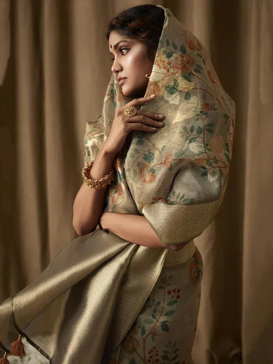 Elegant Indian woman in floral embroidered saree with golden dupatta, traditional ethnic wear