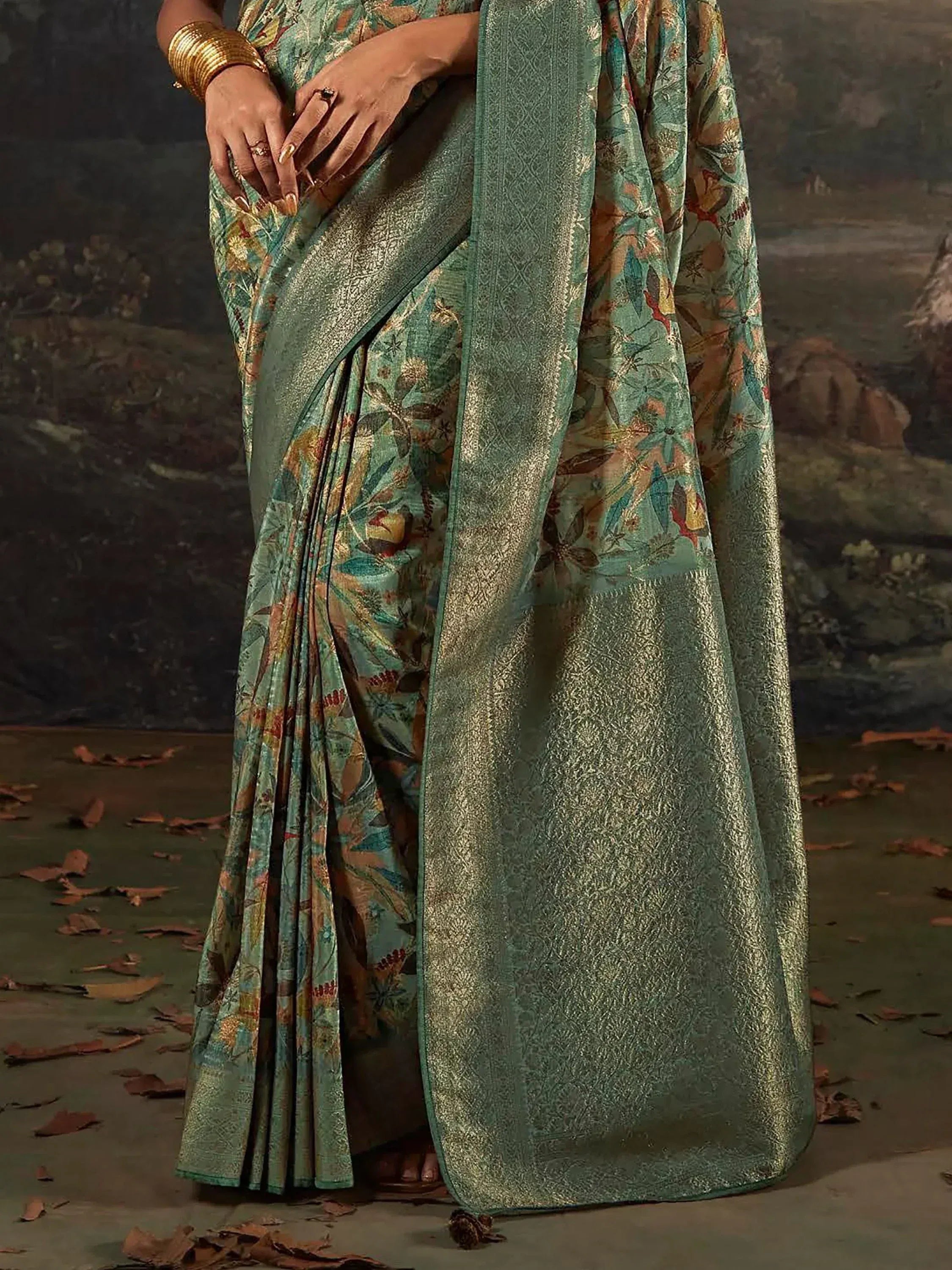 Elegant green floral saree with gold zari border, perfect for Indian ethnic occasions