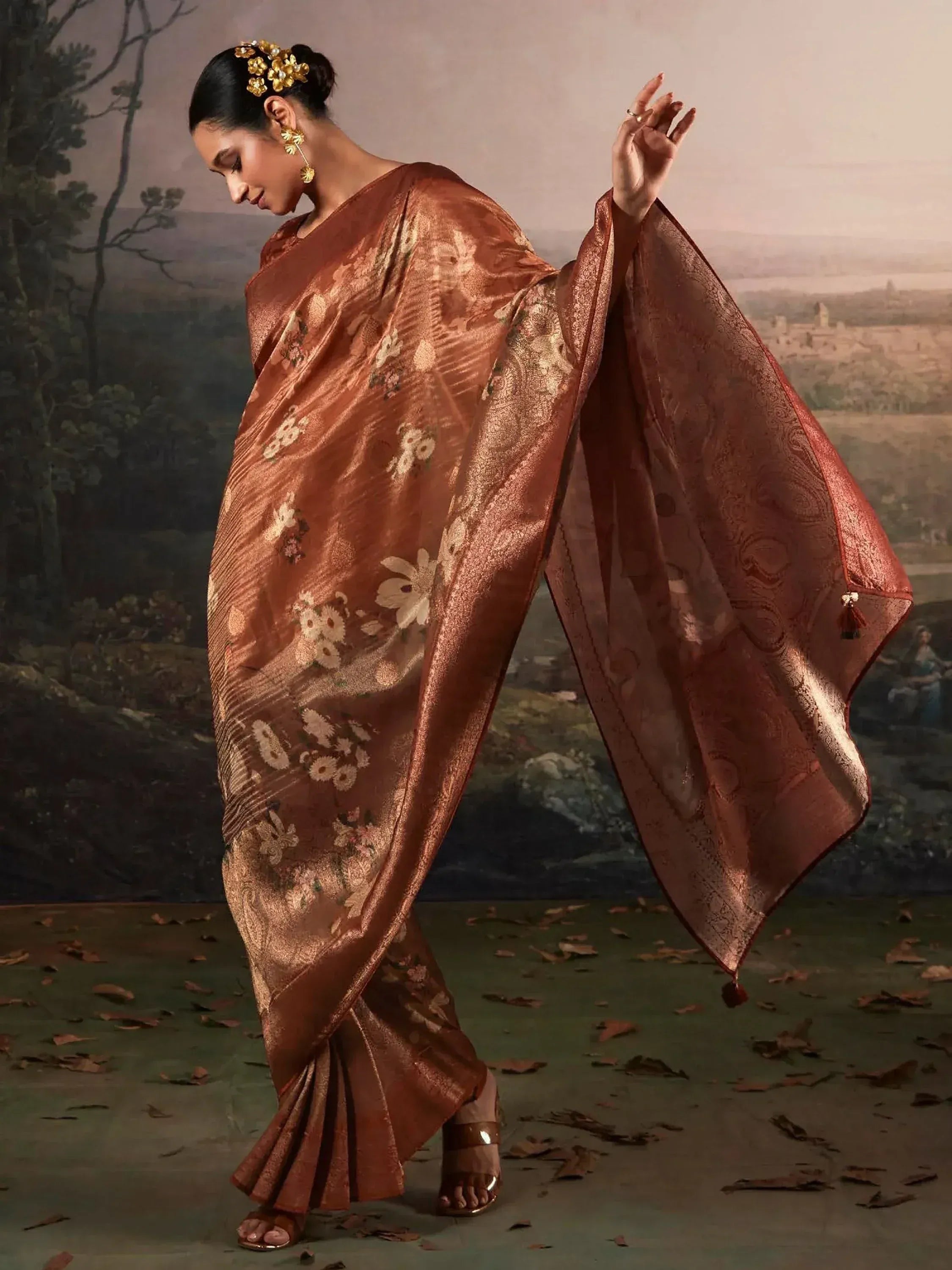 Elegant brown floral saree with gold embroidery, perfect for Indian ethnic wear occasions