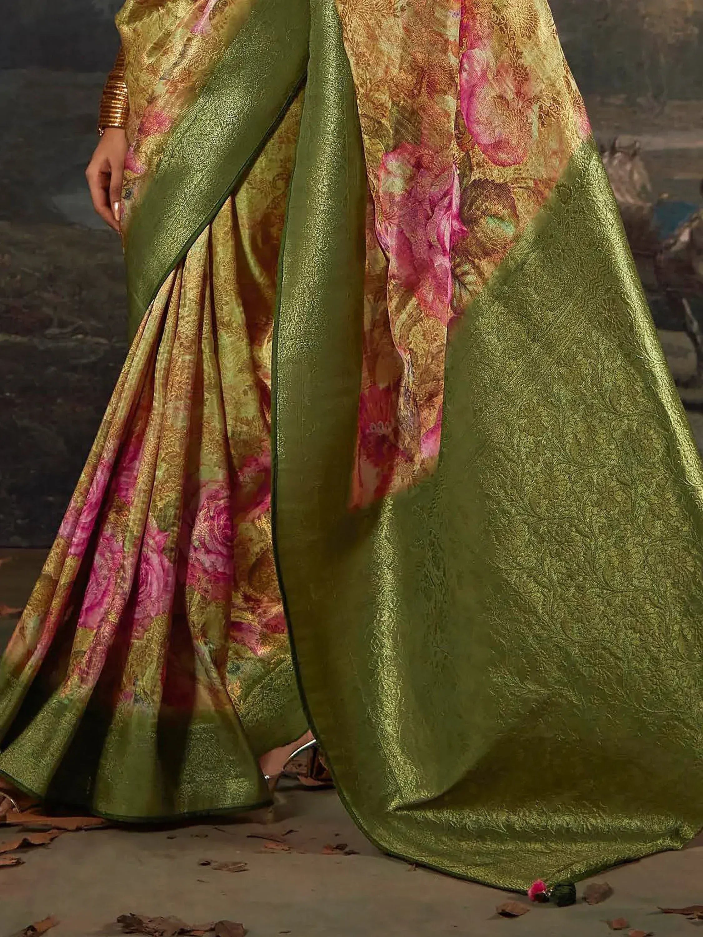 Green and gold floral printed saree with pink accents, elegant Indian ethnic wear