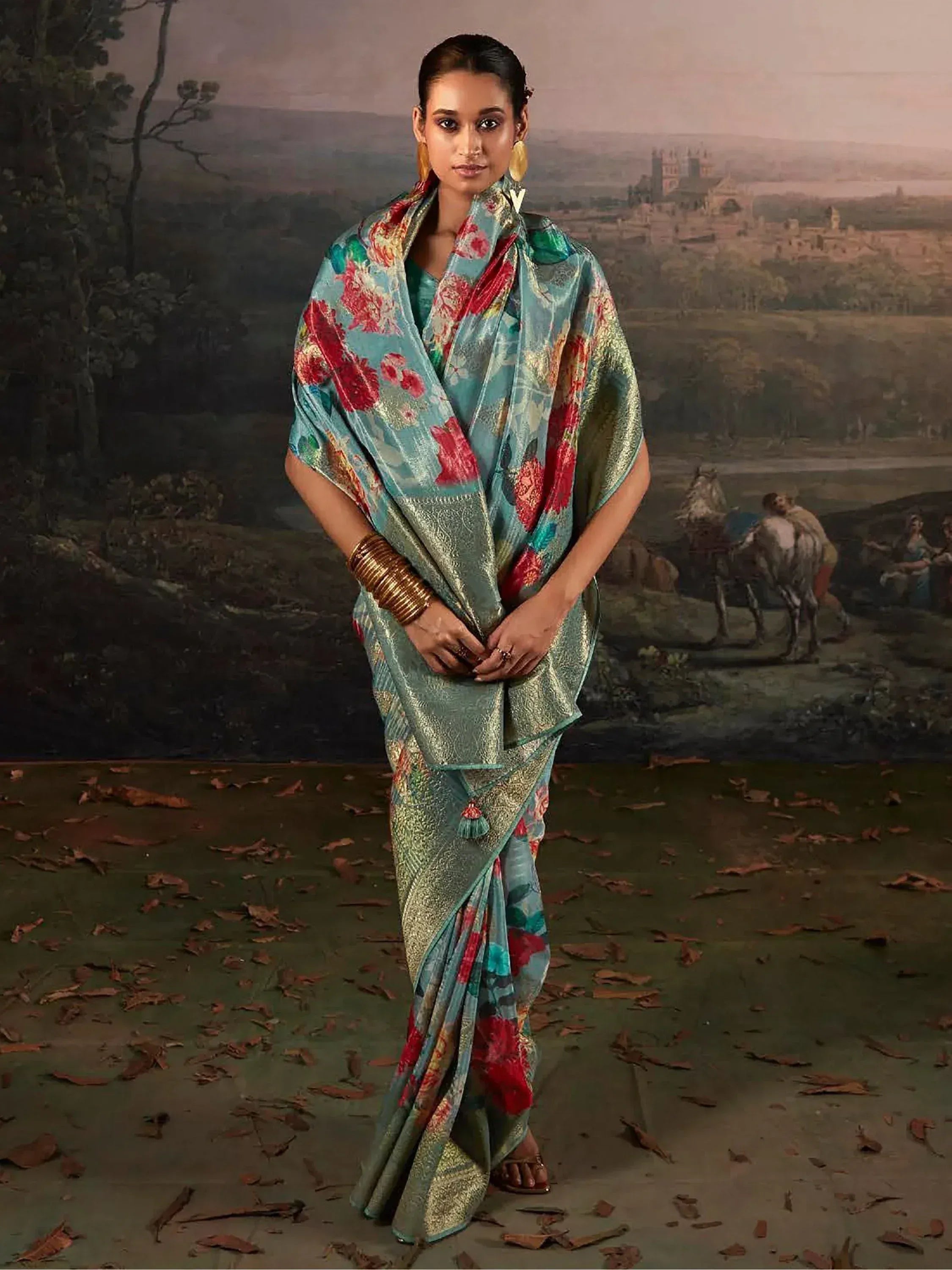 Woman in elegant floral print saree with gold zari, perfect for Indian ethnic wear occasions