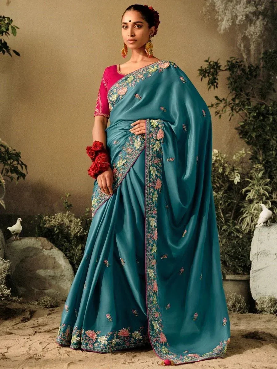 Teal floral embroidered saree with pink blouse, perfect for Indian ethnic occasions and weddings
