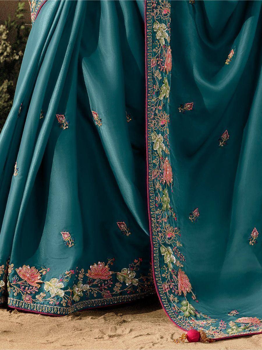Teal saree with floral embroidery and sequin detailing, perfect for Indian ethnic wear occasions