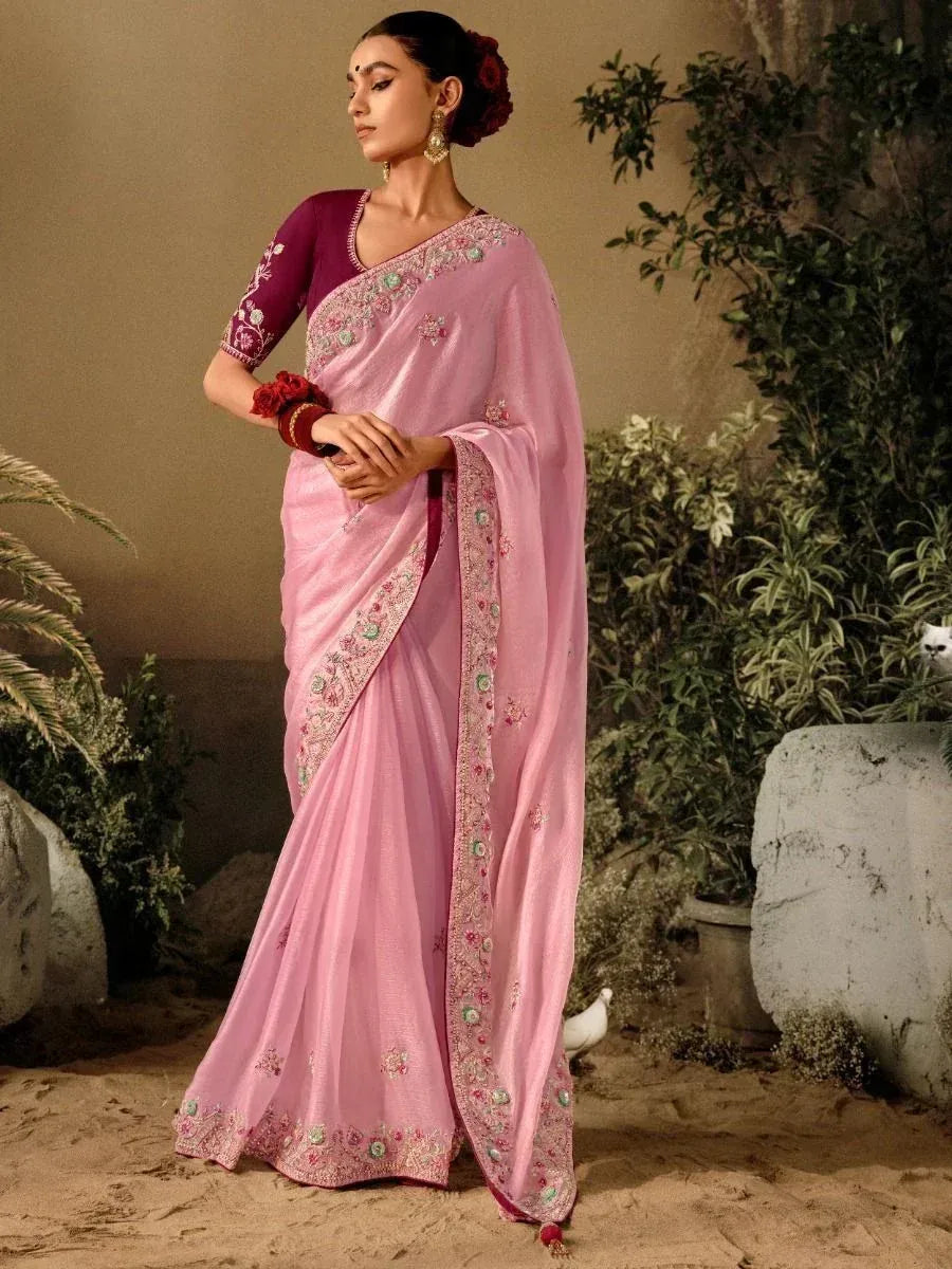 Elegant pink embroidered saree with purple blouse, perfect for Indian ethnic occasions