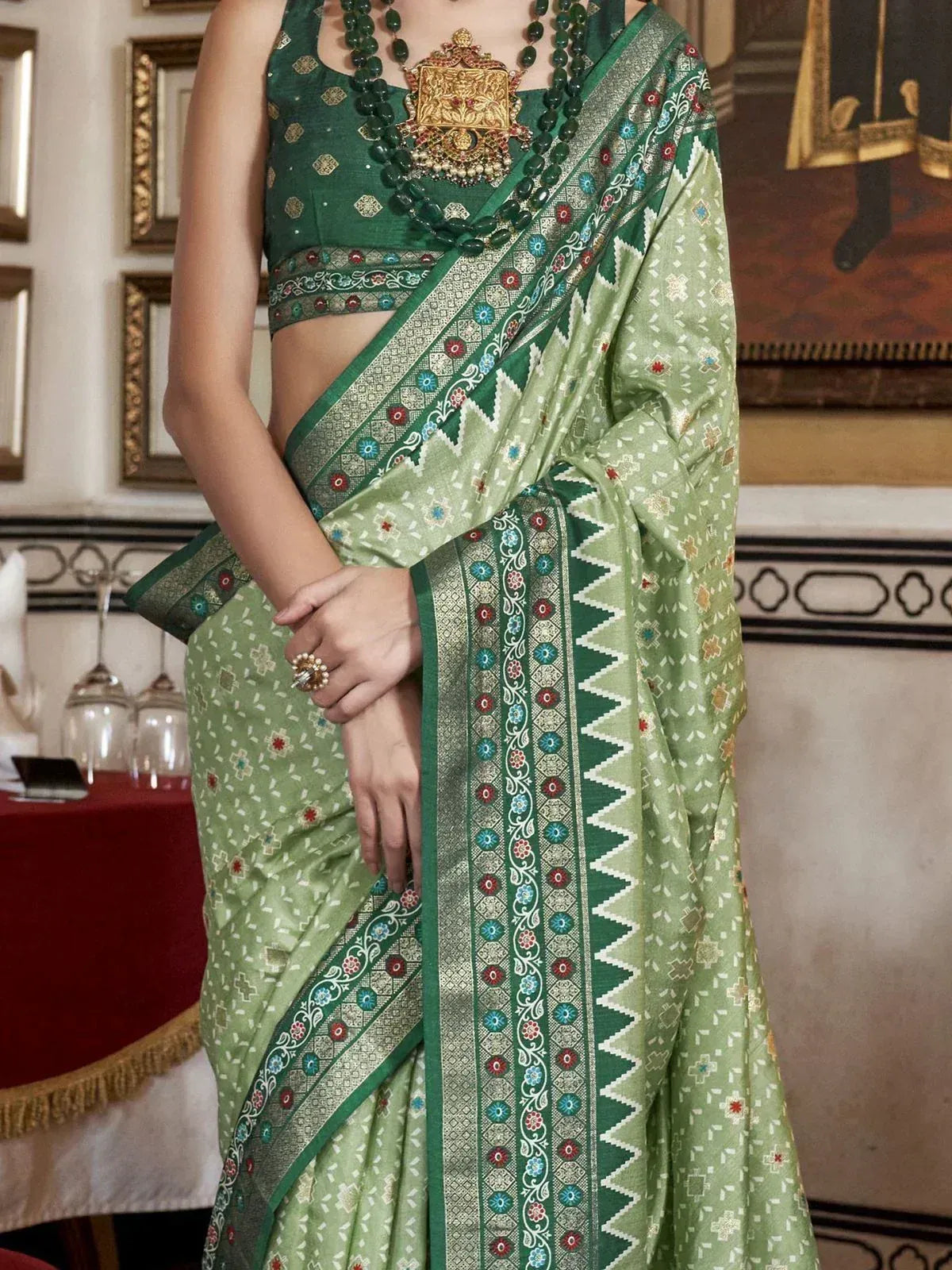 Green embroidered saree with matching blouse and statement necklace, traditional Indian ethnic wear