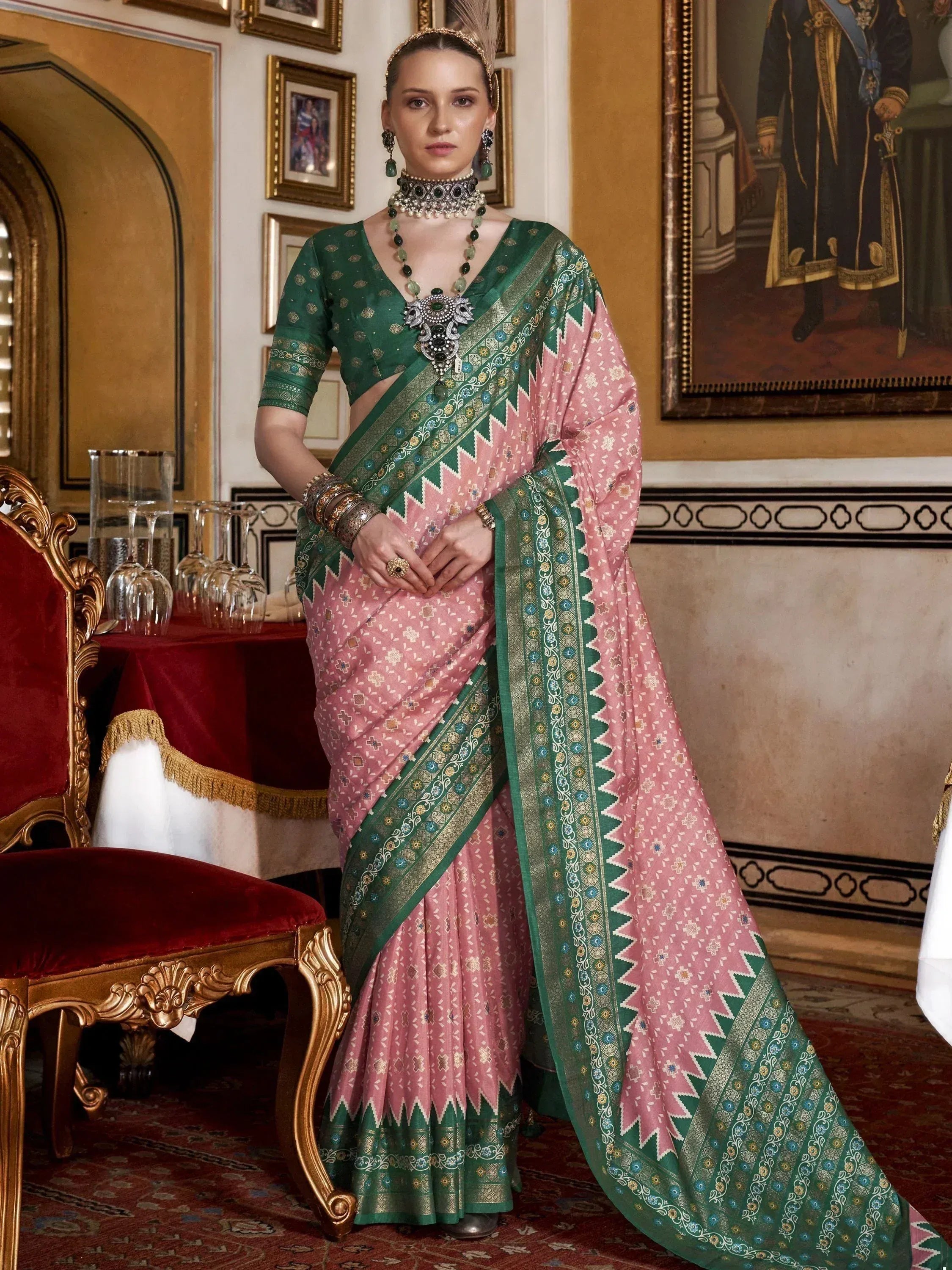 Elegant pink and green designer saree with intricate embroidery, perfect for Indian ethnic wear occasions.