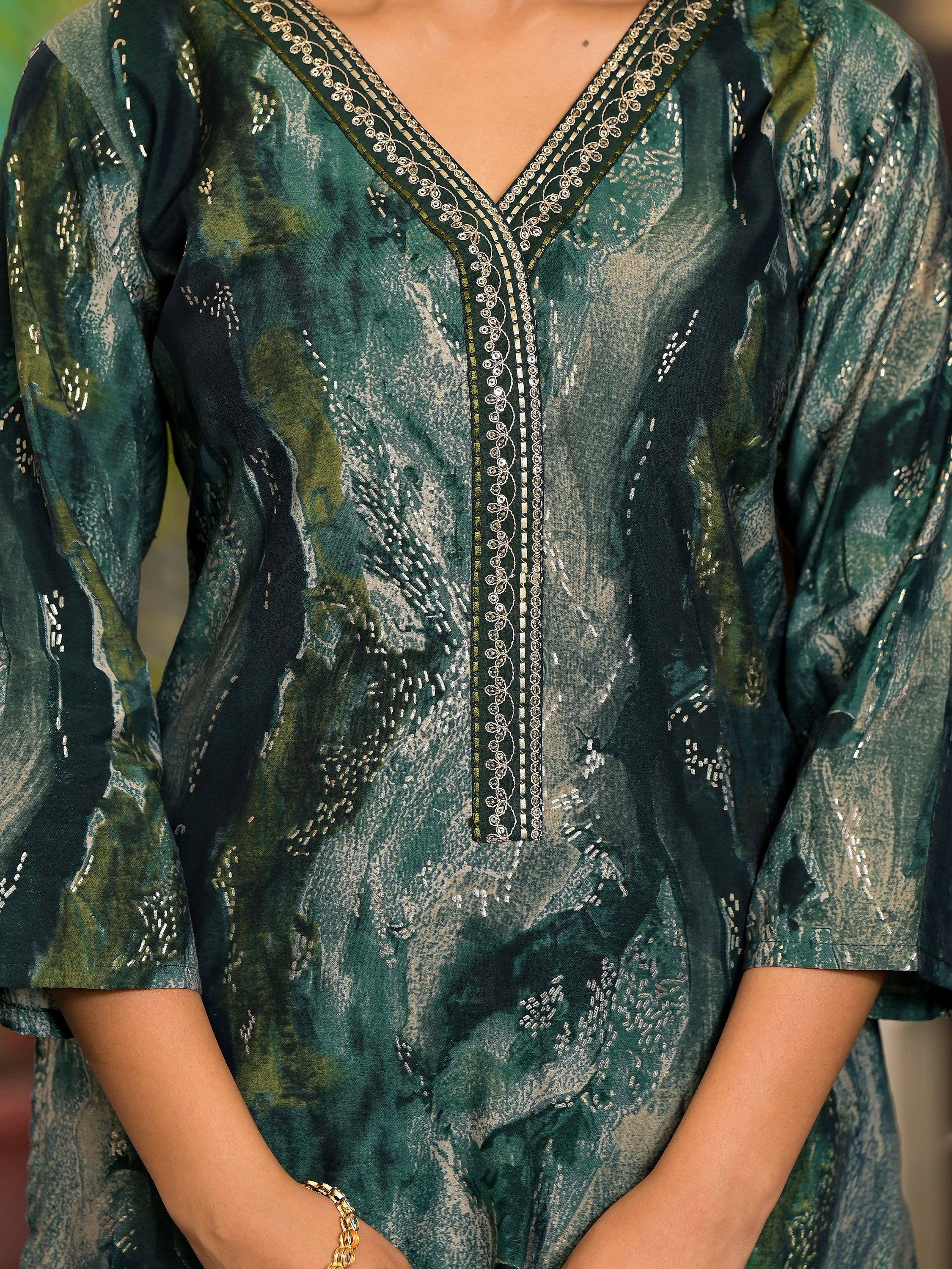 Emerald green ethnic gown with gold embroidery and V-neckline, perfect for festive occasions.