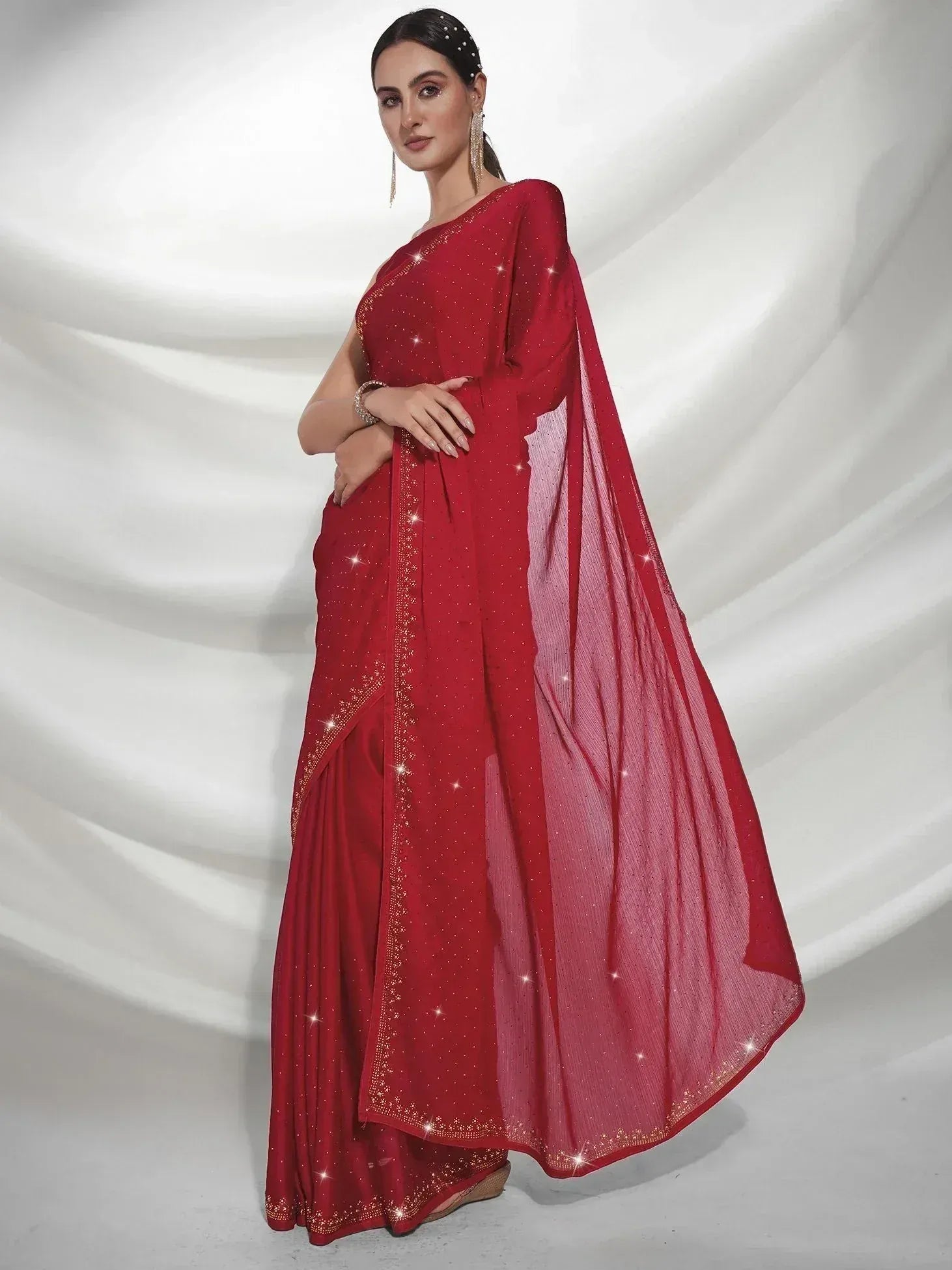 Red designer saree with sequin embellishments and sheer pallu, perfect for Indian ethnic occasions