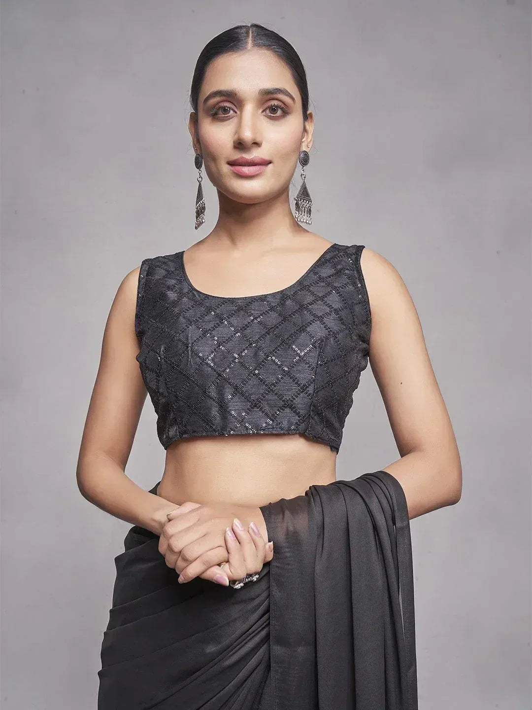 Black sequin saree blouse with diamond pattern, paired with matching saree, elegant ethnic wear