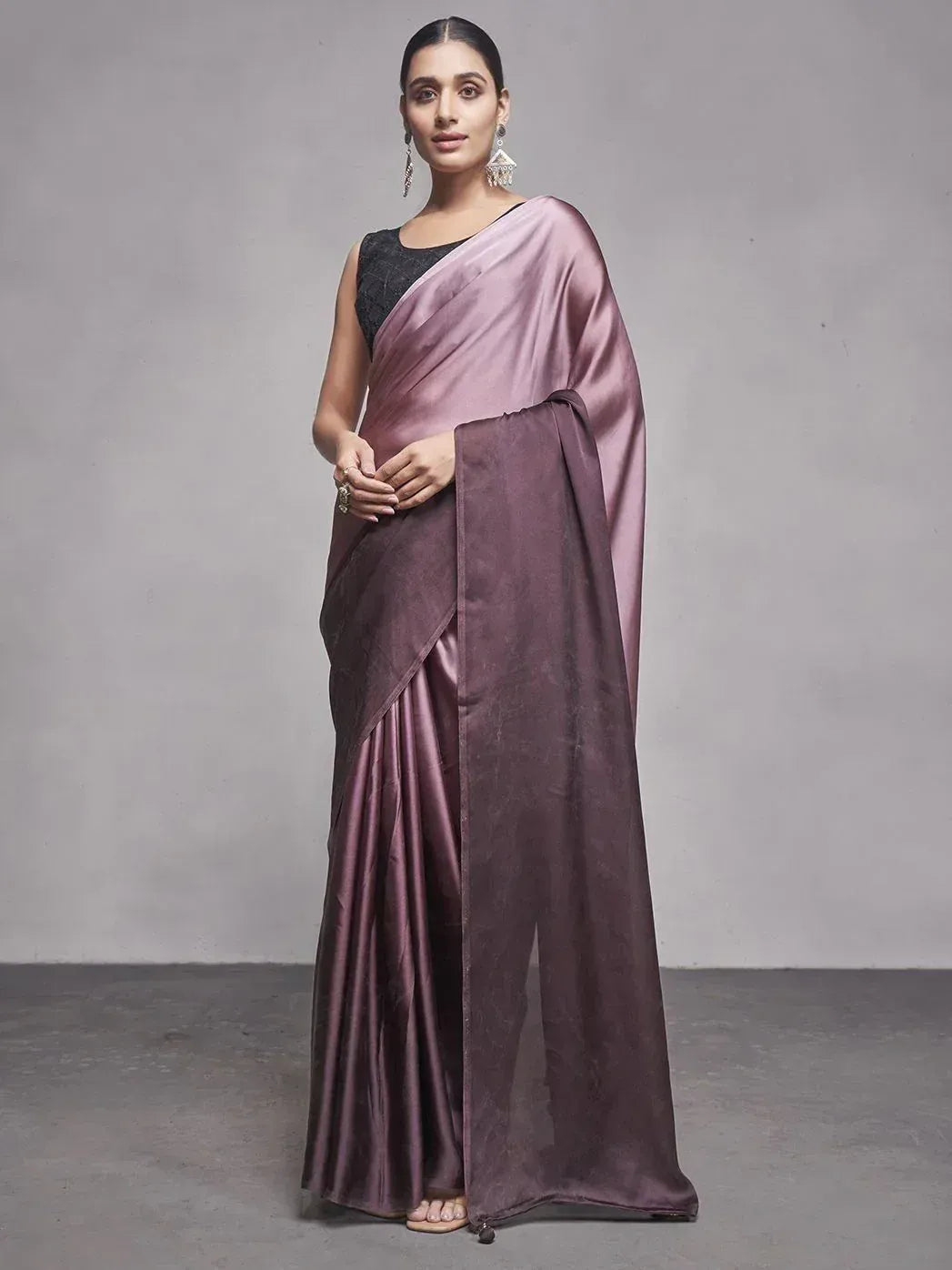 Elegant mauve satin saree with black blouse, perfect for Indian ethnic occasions and festive wear.