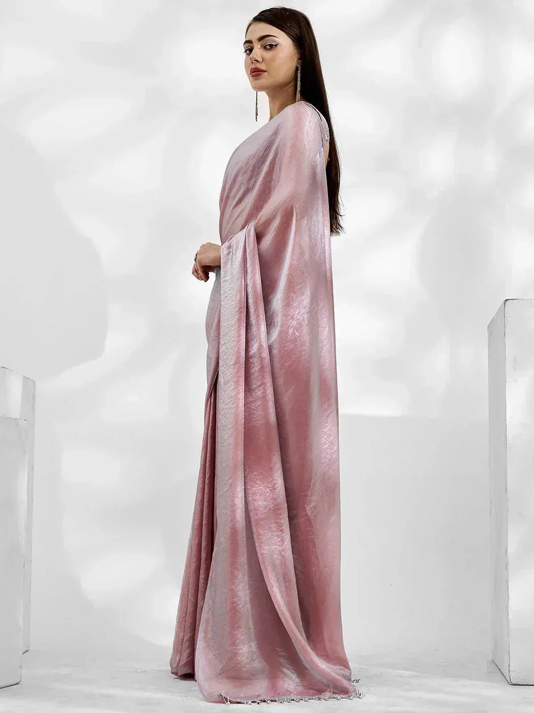 Elegant pink velvet saree with shimmering texture, styled for Indian ethnic wear occasions