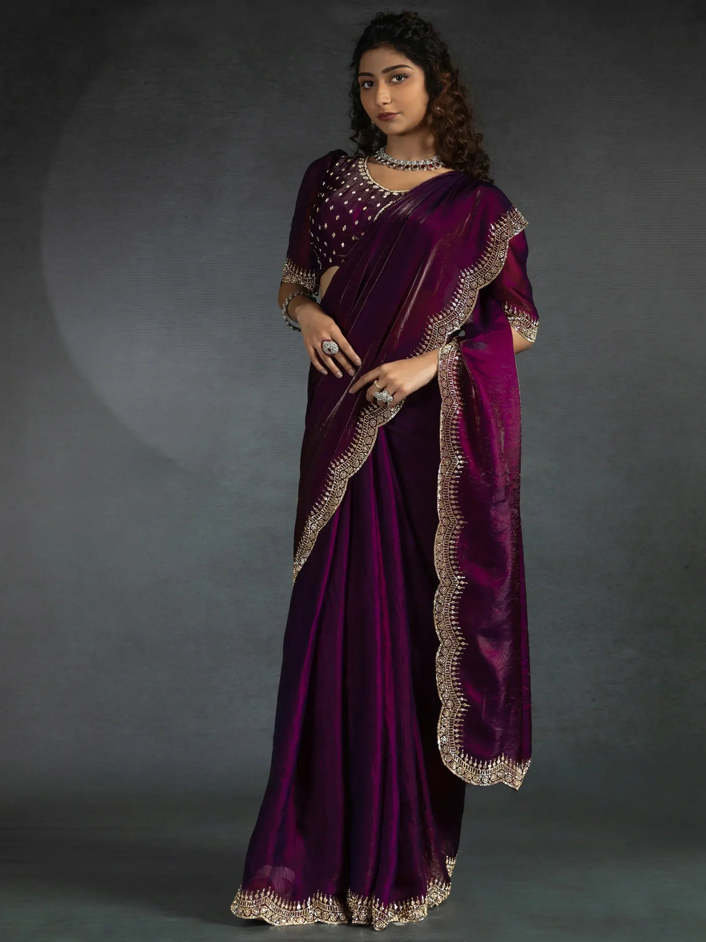 Elegant purple saree with gold embroidery, perfect for Indian ethnic wear occasions.