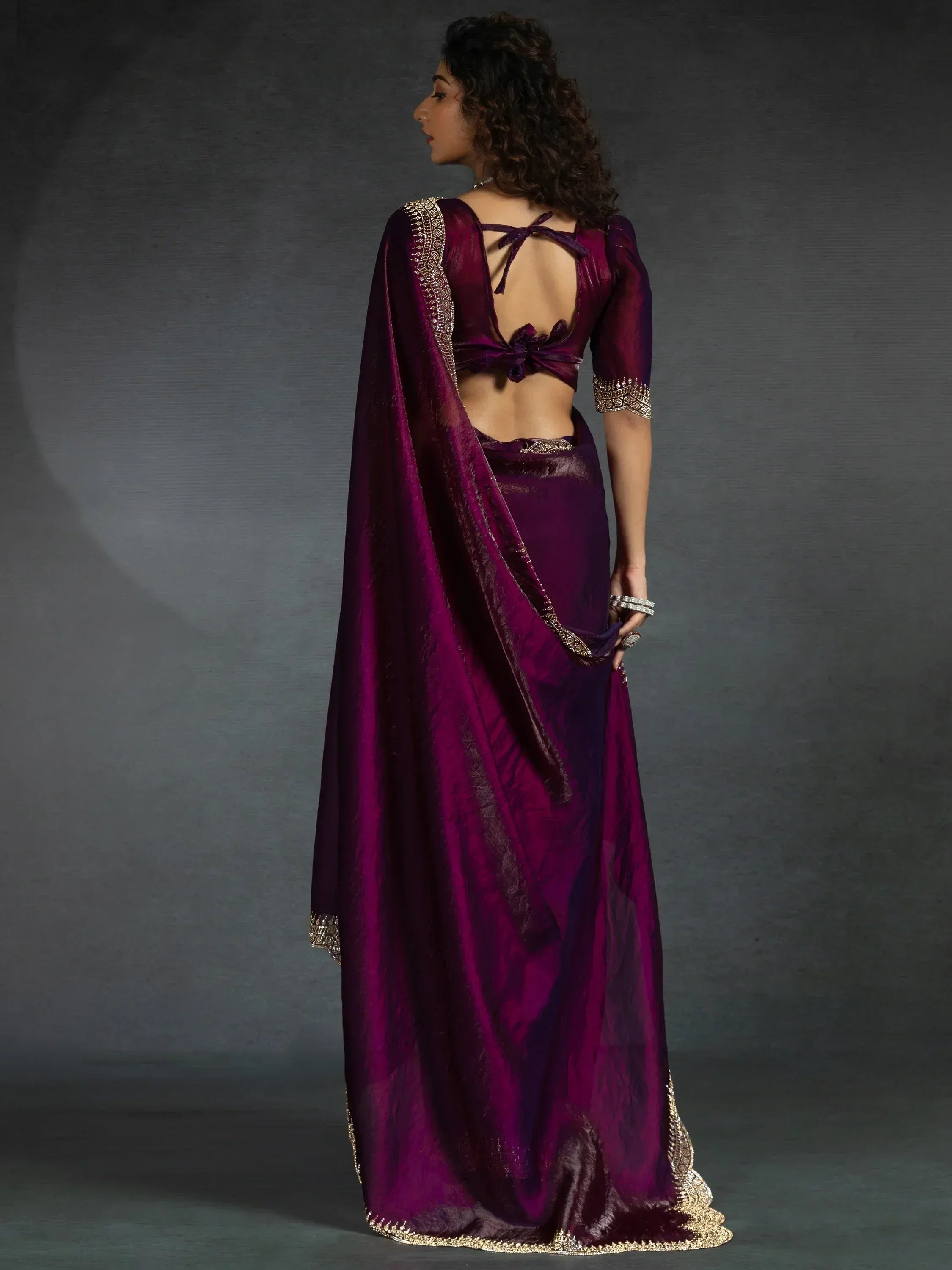 Elegant purple saree with gold embroidery and back tie blouse design