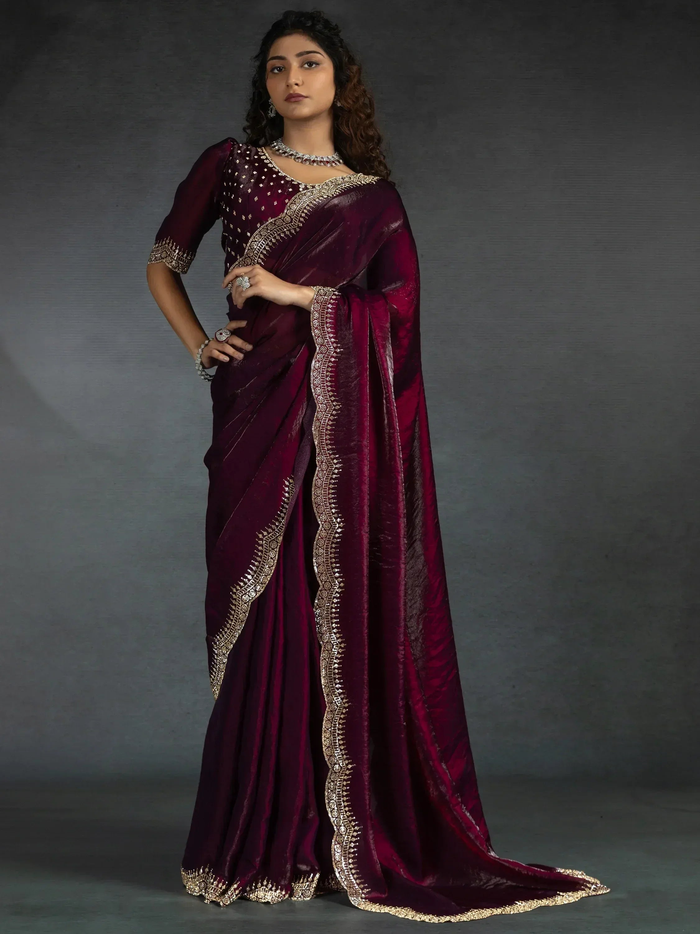 Elegant maroon saree with gold embroidery, perfect for Indian ethnic wear occasions