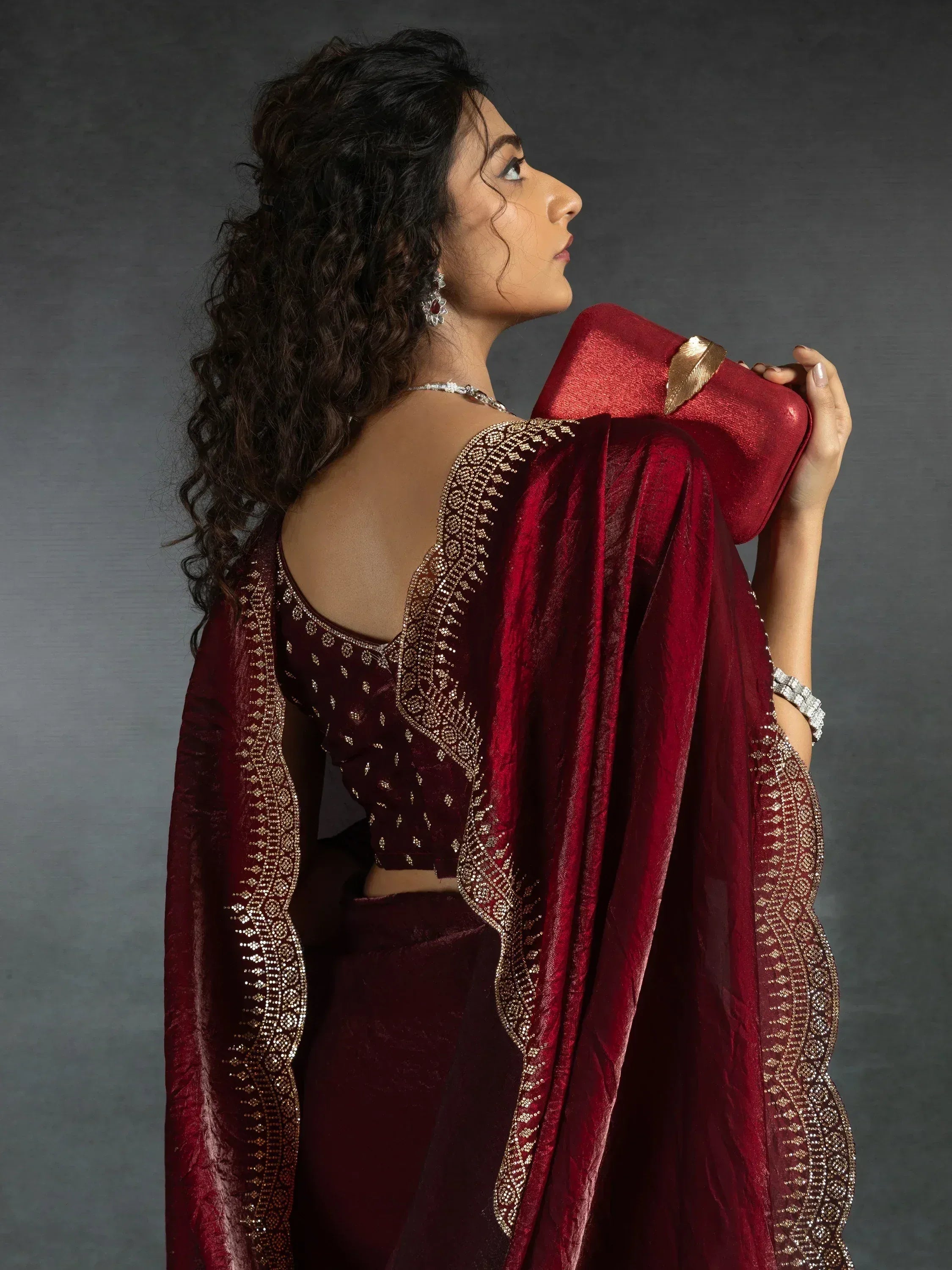 Elegant maroon saree with gold embroidery, perfect for Indian ethnic wear occasions