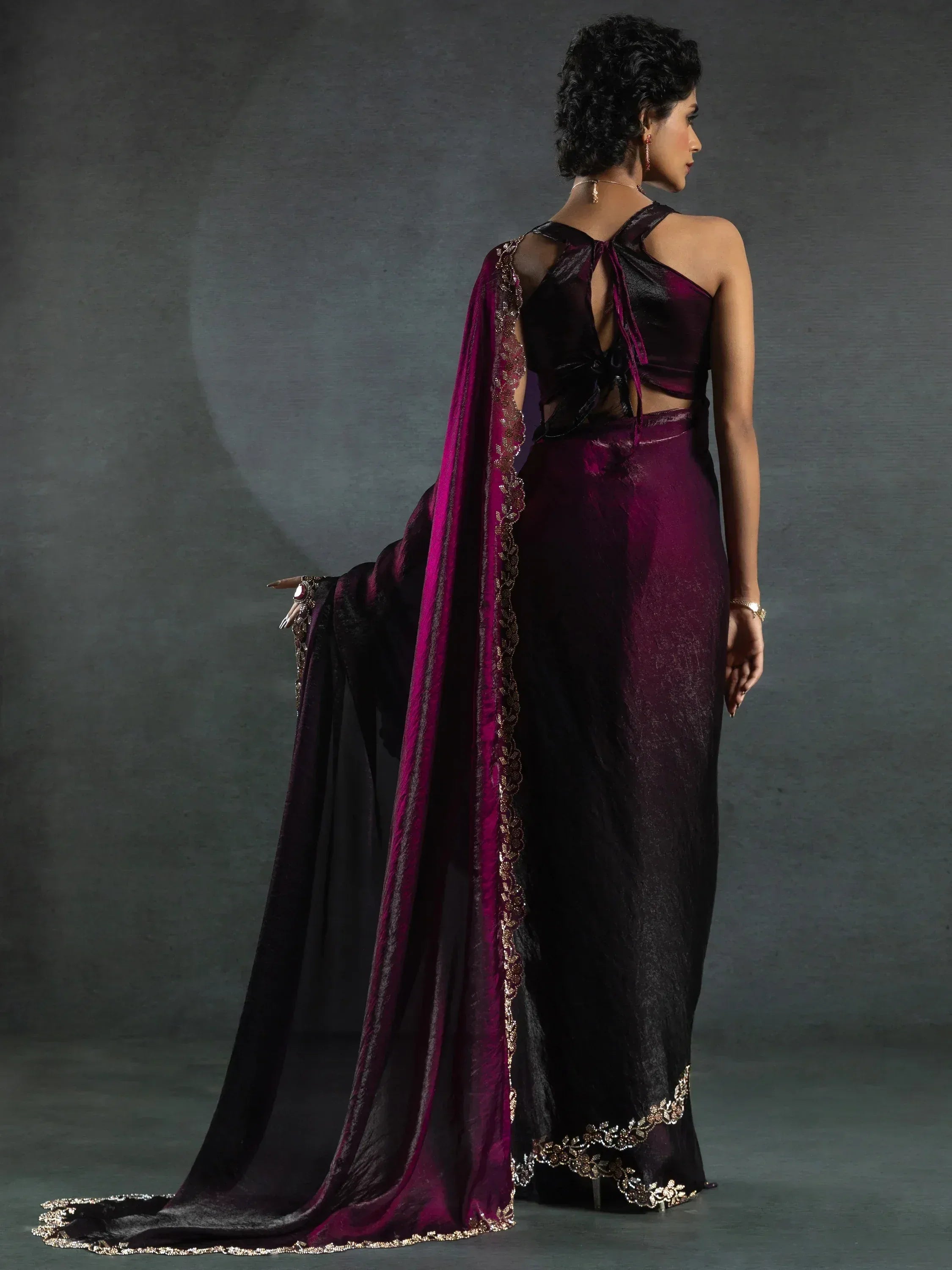 Elegant purple and black ethnic gown with gold embroidery and flowing dupatta