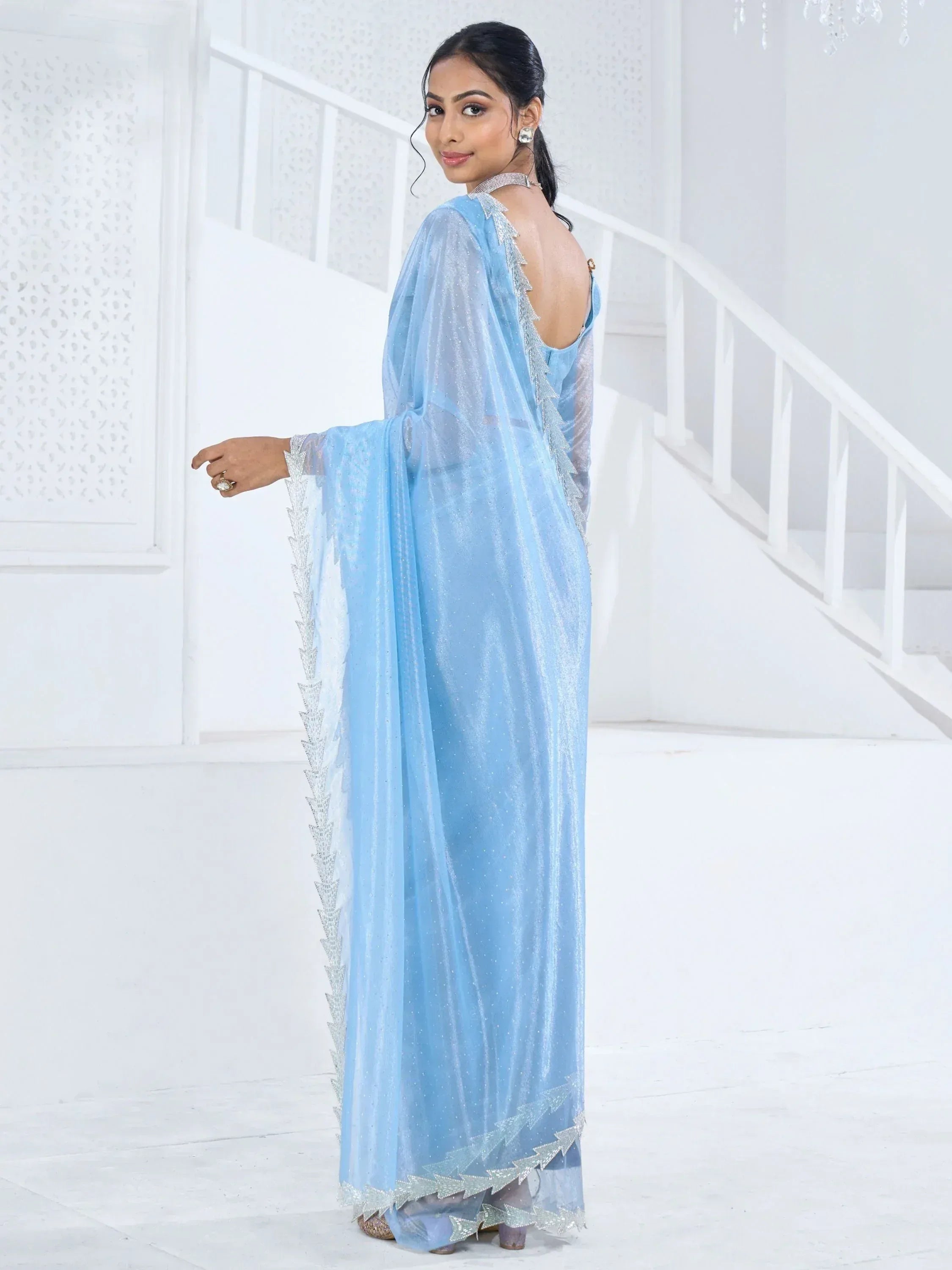 Light blue ethnic gown with silver embellishments, backless design, sheer sleeves, perfect for Indian occasions